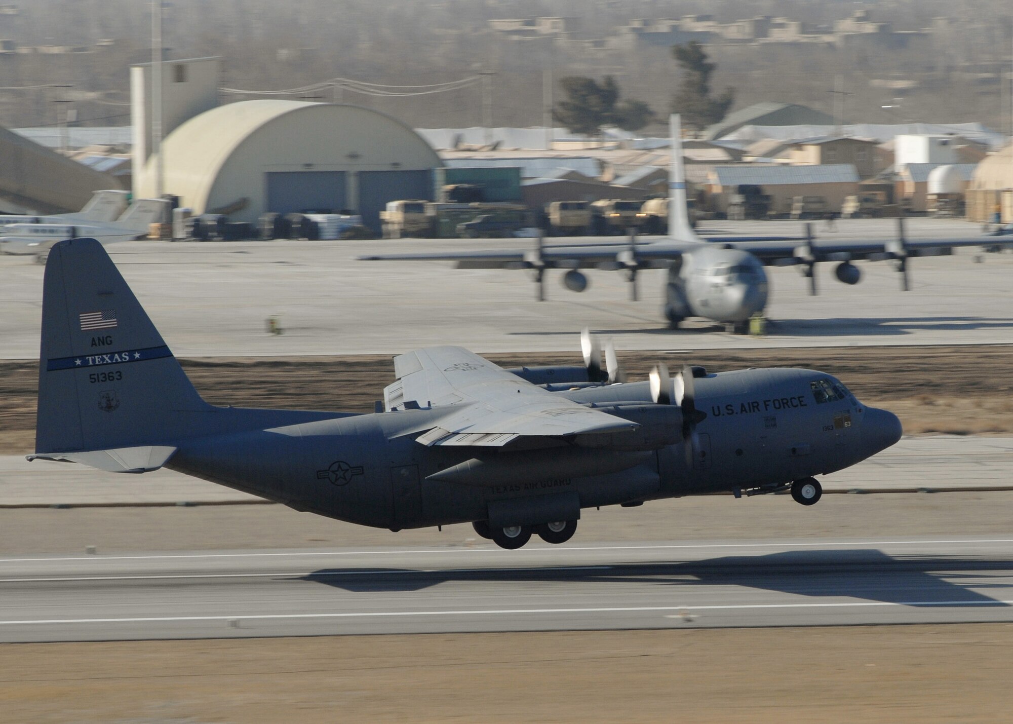 BAGRAM AIR BASE, Afghanistan - A Texas Air National Guard C-130, from Fort Worth, Texas, takes off on a mission supporting Operation ENDURING FREEDOM here Feb. 24. C-130s and the crews from the 774th Expeditionary Airlift Squadron are integral to operations throughout the region -- they are the backbone of intratheater supply and troop movement flying at least 36 missions a week. (U.S. Air Force photo by Master Sgt. Demetrius Lester)