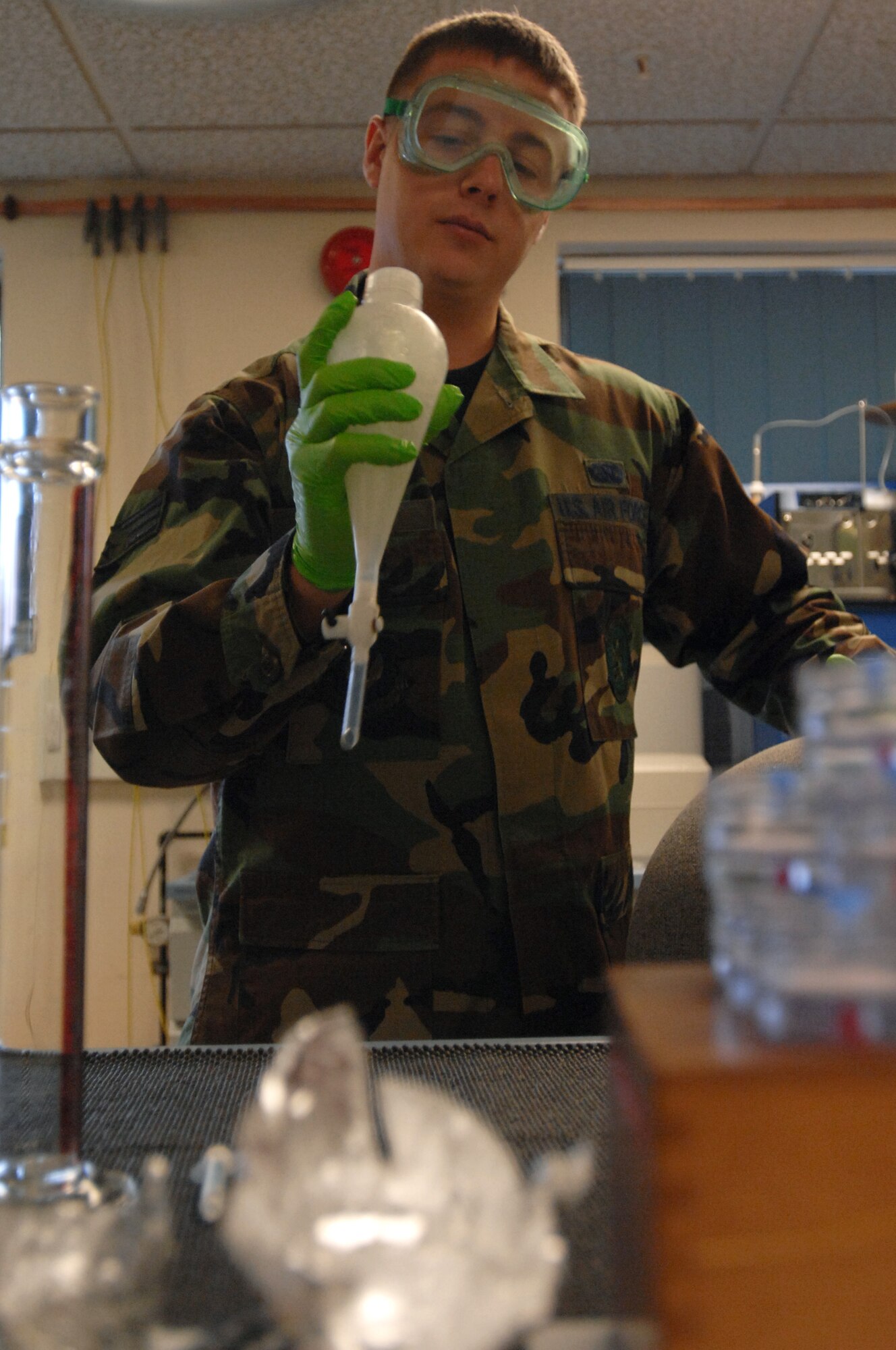 Senior Airman Andrew Hunn, 100th Logistics Readiness Squadron Fuels Management Flight lab technician, tests newly-delivered JP-8 for the proper mix of additives at RAF Mildenhall.  Fuels management Airmen must ensure the highest quality standards with each fuel delivery, often millions of gallons a week.  Last fiscal year, the flight kept the lifeblood of airpower flowing by delivering more than 35 million gallons of JP-8 to every aircraft touching down here.  (U.S. Air Force photo by Senior Airman Teresa Hawkins)
