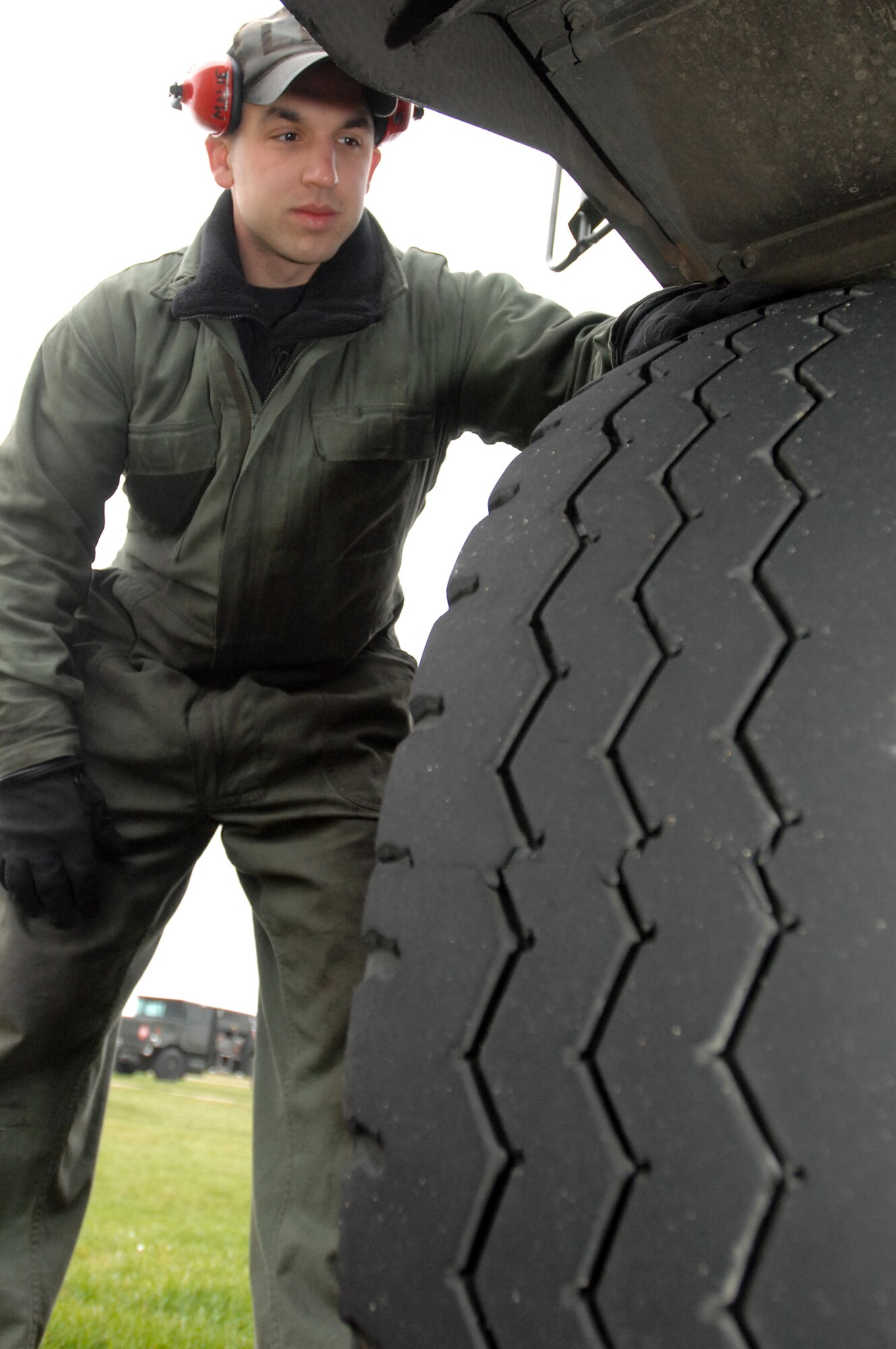 Senior Airman Matthew Gilbert, 100th Logistics Readiness Squadron Fuels Management Flight refueling maintenance technician, performs a morning operations check on an R-11 refueling vehicle at RAF Mildenhall.  Fuels management Airmen kept the lifeblood of airpower flowing by delivering more than 35 million gallons of JP-8 in fiscal 2007.  Airman Gilbert and his coworkers maintain a fleet of 13 vehicles.  (U.S. Air Force photo by Tech. Sgt. Eric Petosky)