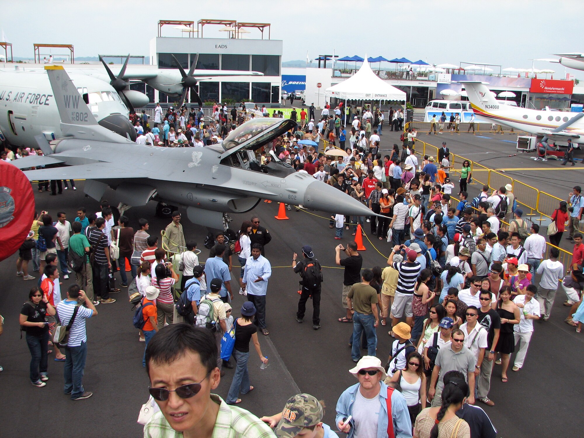 Crowds gather around an F-16CJ static display during a public day at the 2008 Singapore Air Show Feb. 23.  Assigned to the 35th Fighter Wing, Misawa Air Base Japan,  In addition to the static display Pacific Air Forces F-16 Demonstration Team and Pacific Fleet's F/A-18 Super Hornet Demonstation Team performed at the air show. A total of seven aircraft were on static display including F-15C, F-16CJ and F/A-18F fighters, a KC-135 tanker and WC-130J weather reconnaissance aircraft.  (U.S. Air Force Photo by Senior Master Sgt. Charles Ramey)
