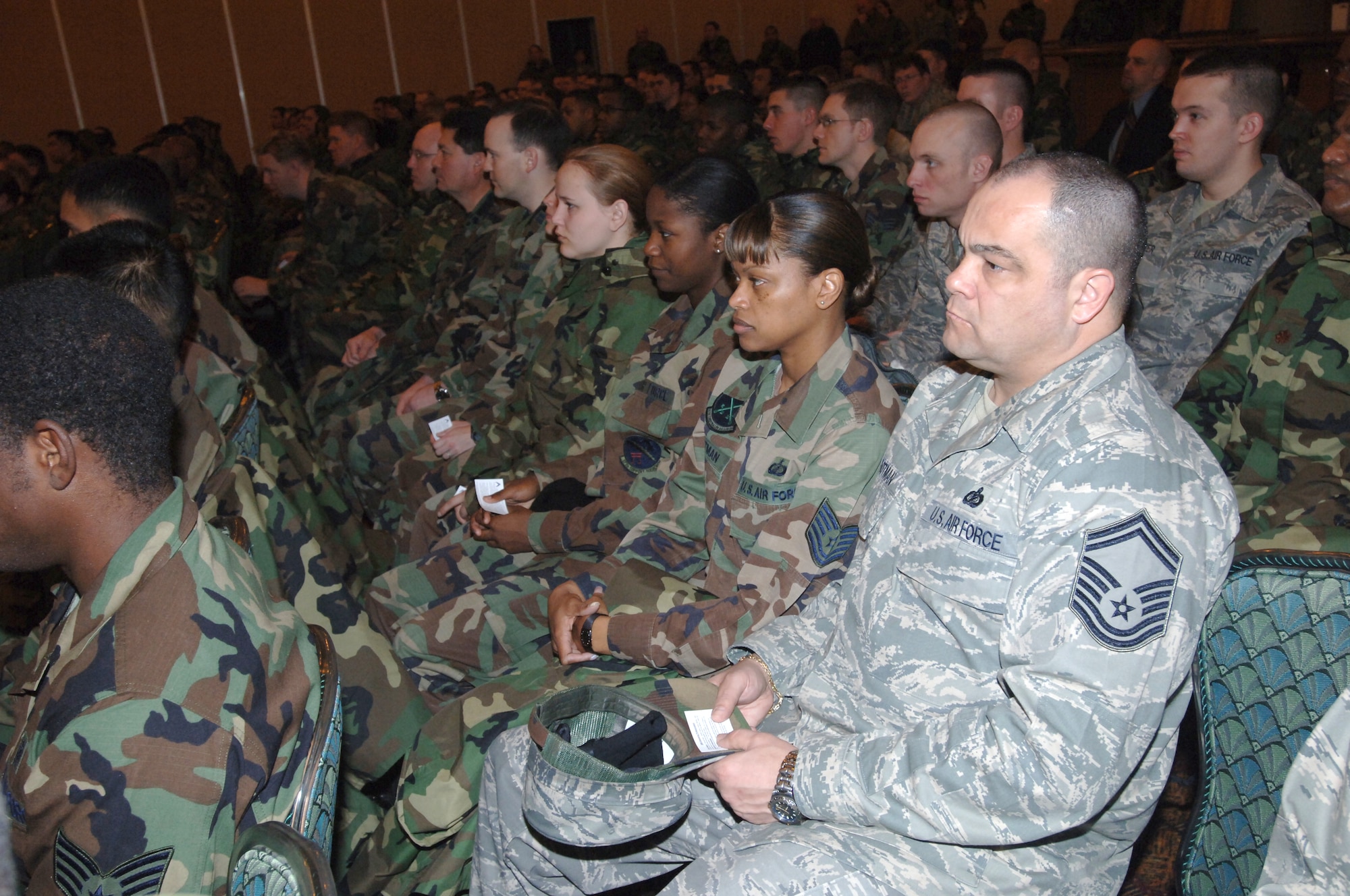 MISAWA AIR BASE, Japan -- Team Misawa members listen to a briefing during which they were provided cards on unwavering professionalism at the enlisted club Feb. 22, 2008.  A commander's call was held as part of U.S. Forces in Japan's "Day of Reflection." (U.S. Air Force photo by Senior Airman Robert Barnett)