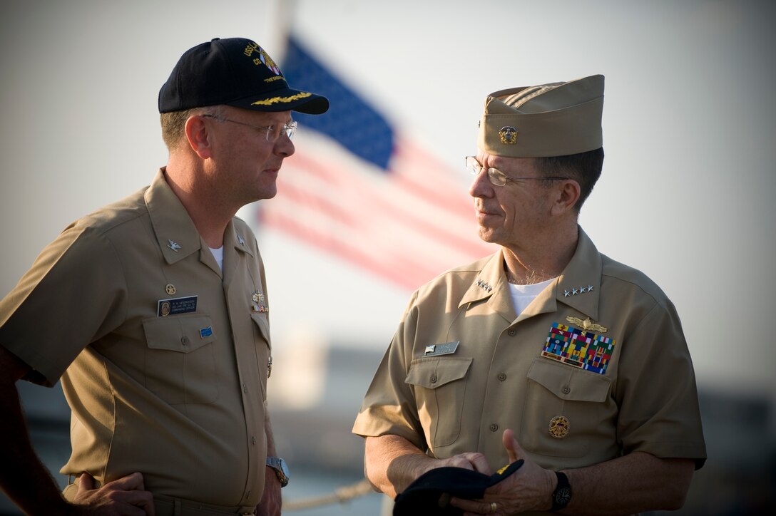 U.S. Navy Capt. Randall M. Hendrickson, left, commanding officer USS Lake Erie, speaks with  Navy Adm. Mike Mullen, chairman of the Joint Chiefs of Staff during a visit to the ship to congratulate the crew on their successful launch of a  Standard Missile-3 at a non-functioning National Reconnaissance Office satellite as it traveled in space at more than 17,000 mph over the Pacific Ocean, Feb. 23, 2008.