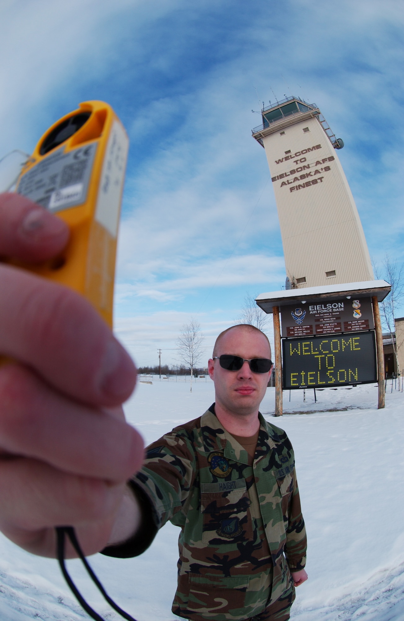 EIELSON AIR FORCE BASE, Alaska -- Staff Sgt. Andrew Haight uses a Kestrel 4000 weather monitoring device determining wind speed, barometric pressure and temperature outside Feb. 25. Airmen of the 354th Operation Support Squadron weather flight constantly monitor and predict future weather conditions and compile that information into a daily report for the base pilots' morning briefings. (U.S. Air Force Photo/Airman 1st Class Jonathan Snyder)