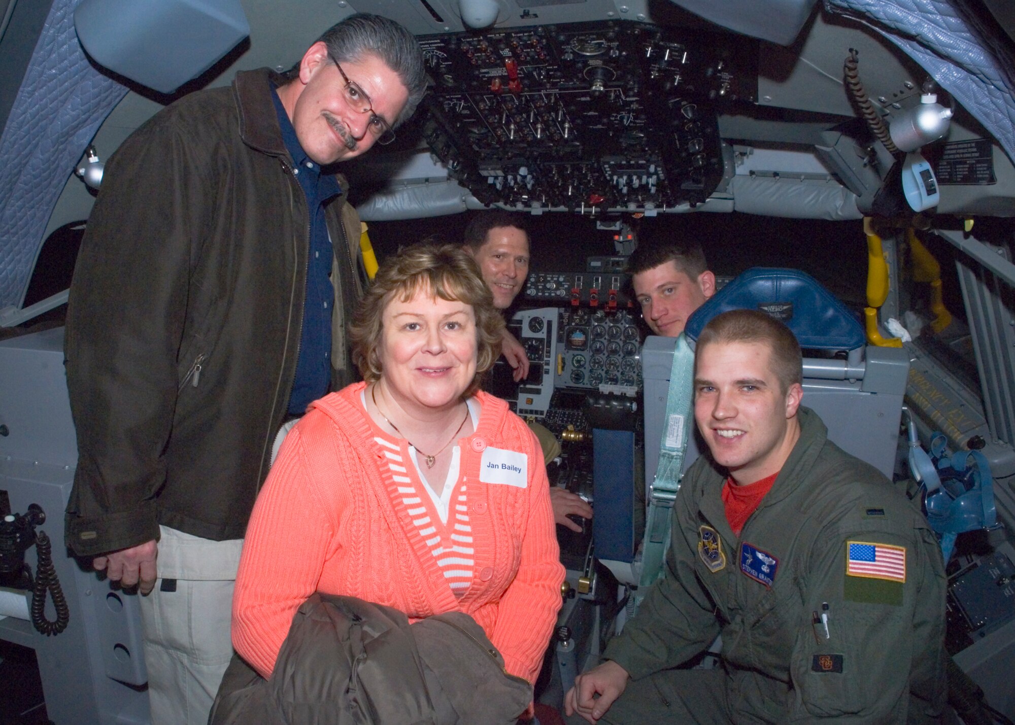 FAIRCHILD AIR FORCE BASE, Wash. – Honorary commander of the 92nd Civil Engineer Squadron, Jan Bailey, her husband Ray Lessard (both in the foreground), and honorary commander of the 92nd Contracting Squadron, Keith Emberton (in the pilot’s seat), with pilots from the 93d Air Refueling Squadron 1st Lt. Stephen Grantier and Capt. Mark Thomas, pose for the camera in the flight deck of a Fairchild flight simulator Feb 22. Fairchild pilots encouraged honorary commanders to land and fly KC-135’s in very trying conditions. (U.S. Air Force photo / Airman 1st Class Joshua Chapman)
