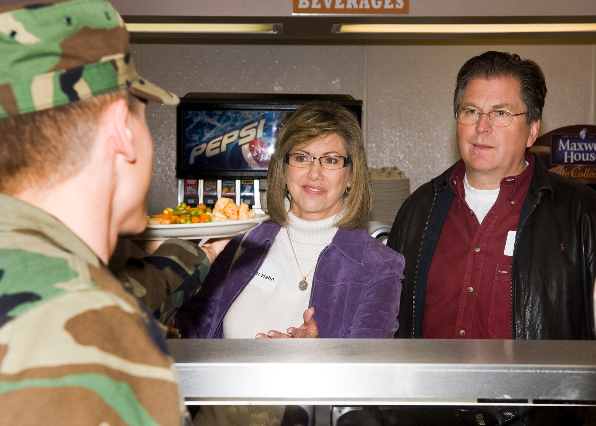 FAIRCHILD AIR FORCE BASE, Wash. – Honorary commander of the 92nd Medical Group, Dr. John Hahn, a Spokane anesthesiologist, and his wife, Dawn, order lunch at Fairchild’s Warrior Dining Facility during a base visit, Feb 22. Honorary commanders representing groups and squadrons throughout the base spent the day visiting Fairchild to learn more about normal operations of the base. Their stops included the Warrior Dining Facility, the flight simulator and the radar tower. (U.S. Air Force photo / Airman 1st Class Joshua Chapman)