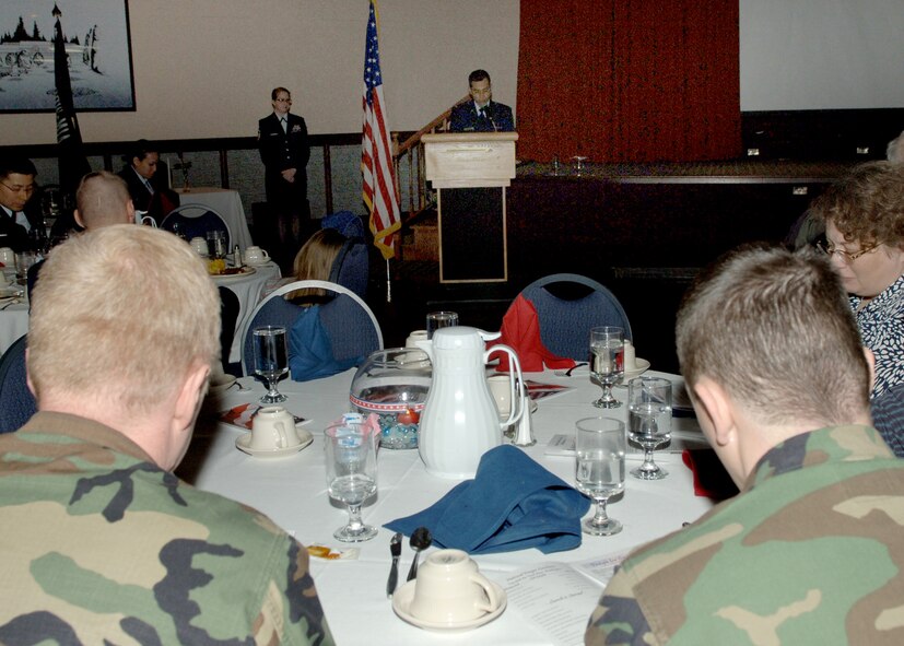 FAIRCHILD AIR FORCE BASE, Wash. – 1st Lt. Hoang Nguyen, 92nd Air Refueling Wing chaplain, leads gathered members of Team Fairchild in a prayer for the nation during the National Prayer Luncheon at Club Fairchild here Feb. 21. (U.S. Air Force photo / Senior Airman Jocelyn Ford)