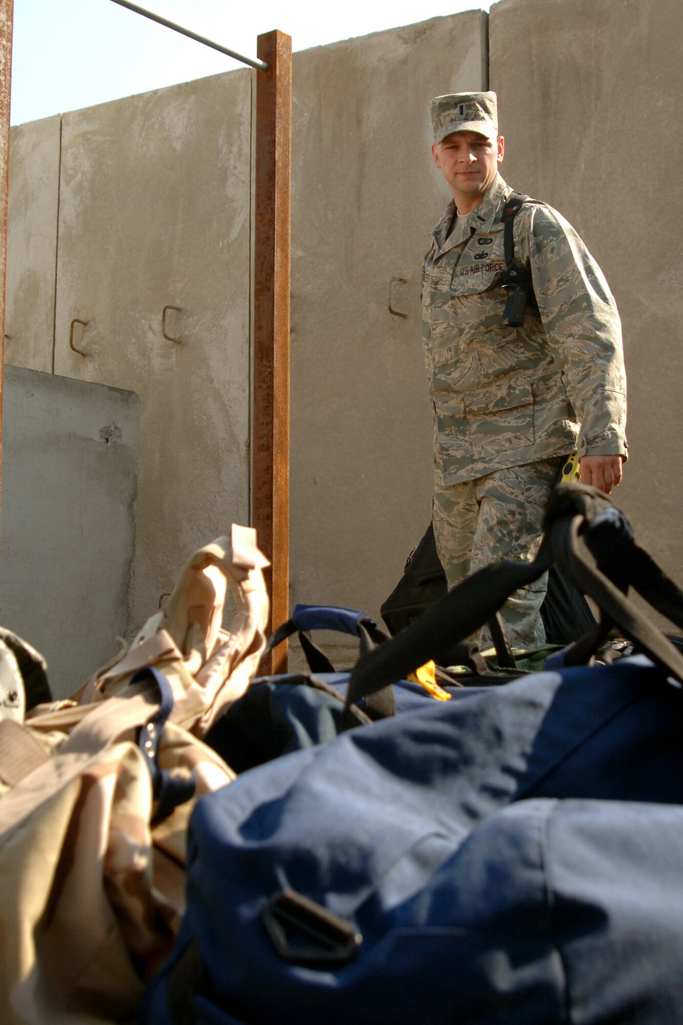 First Lt. Christopher Mazzey carries luggage to a distinguished visitor's quarters here. Protocol personnel help with luggage detail and making sure rooms are ready for any DVs visiting and staying at Balad Air Base, Iraq. Lieutenant Mazzey is the 332nd Air Expeditionary Wing deputy chief of protocol. (U.S. Air Force photo/Tech. Sgt. Heather Cabral)