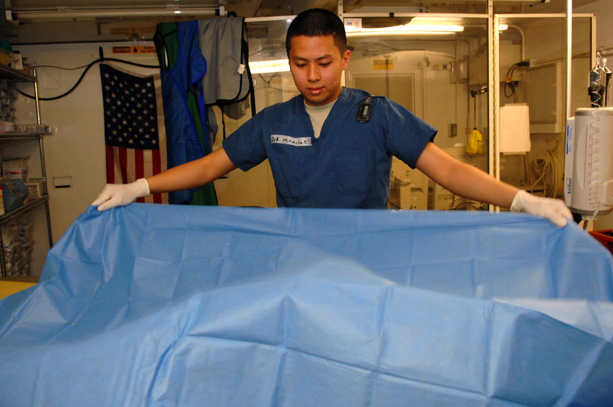 Senior Airman Jason Masiclat sets up a CT scan for a trauma patient at the Air Force Theater Hospital Feb. 20 at Balad Air Base, Iraq. CT scans are a vital tool used to determine internal bleeding or major trauma to any area of the body without having to do exploratory surgery. Airman Masiclat  is a 332nd Expeditionary Medical Support Squadron radiology technologist deployed from Wright-Patterson Air Force Base, Ohio. (U.S. Air Force photo/Senior Airman Julianne Showalter) 