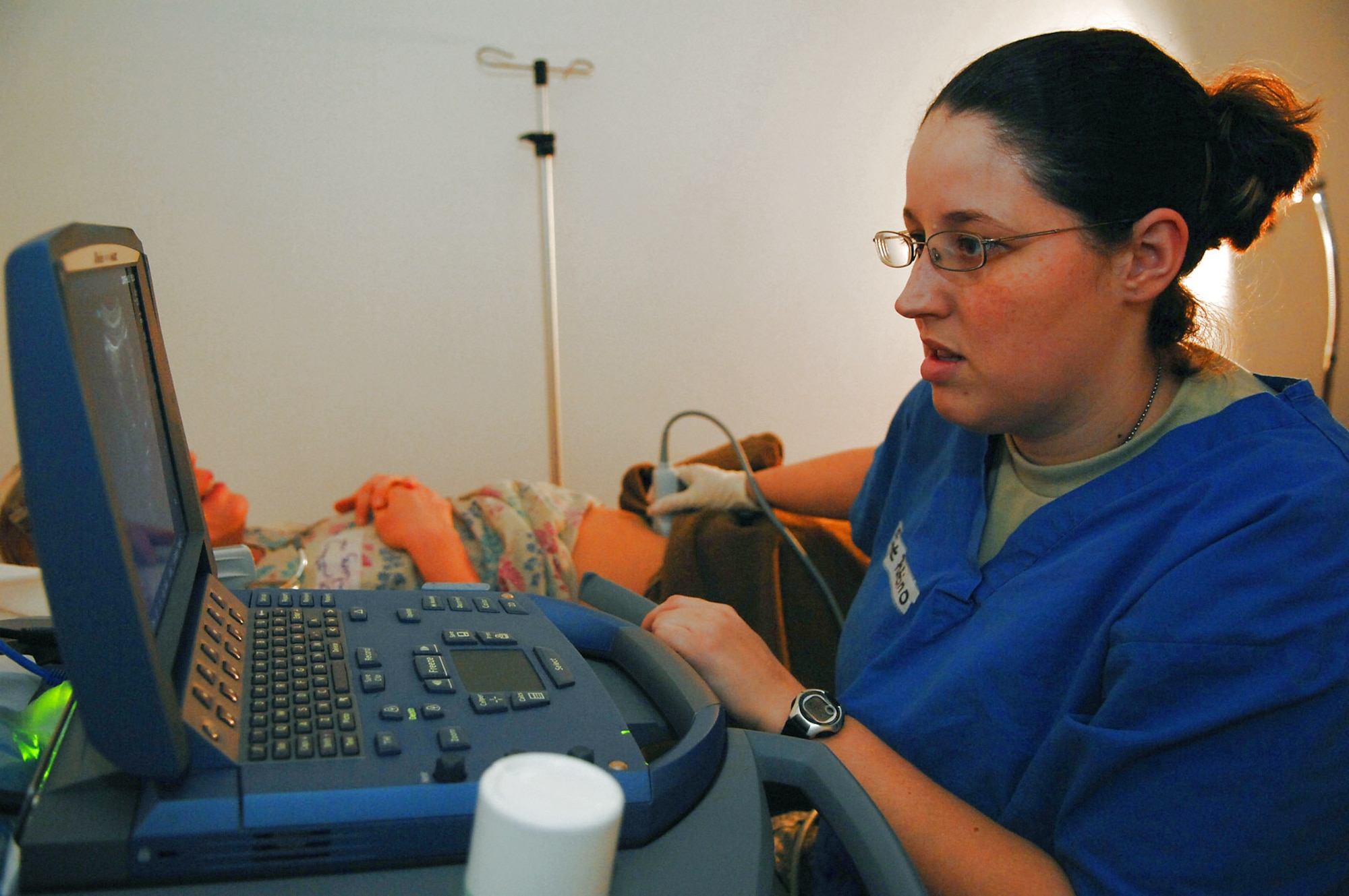 Staff Sgt. Crystal Patino performs a trans-abdominal ultrasound on a patient at the Air Force Theater Hospital Feb 20 at Balad Air Base, Iraq. Ultrasounds can be used to determine the presence of foreign growths, such as kidney stones. Sergeant Patino is a 332nd Expeditionary Medical Support Squadron radiology technologist and is deployed from Lackland Air Force Base, Texas. (U.S. Air Force photo/Senior Airman Julianne Showalter) 