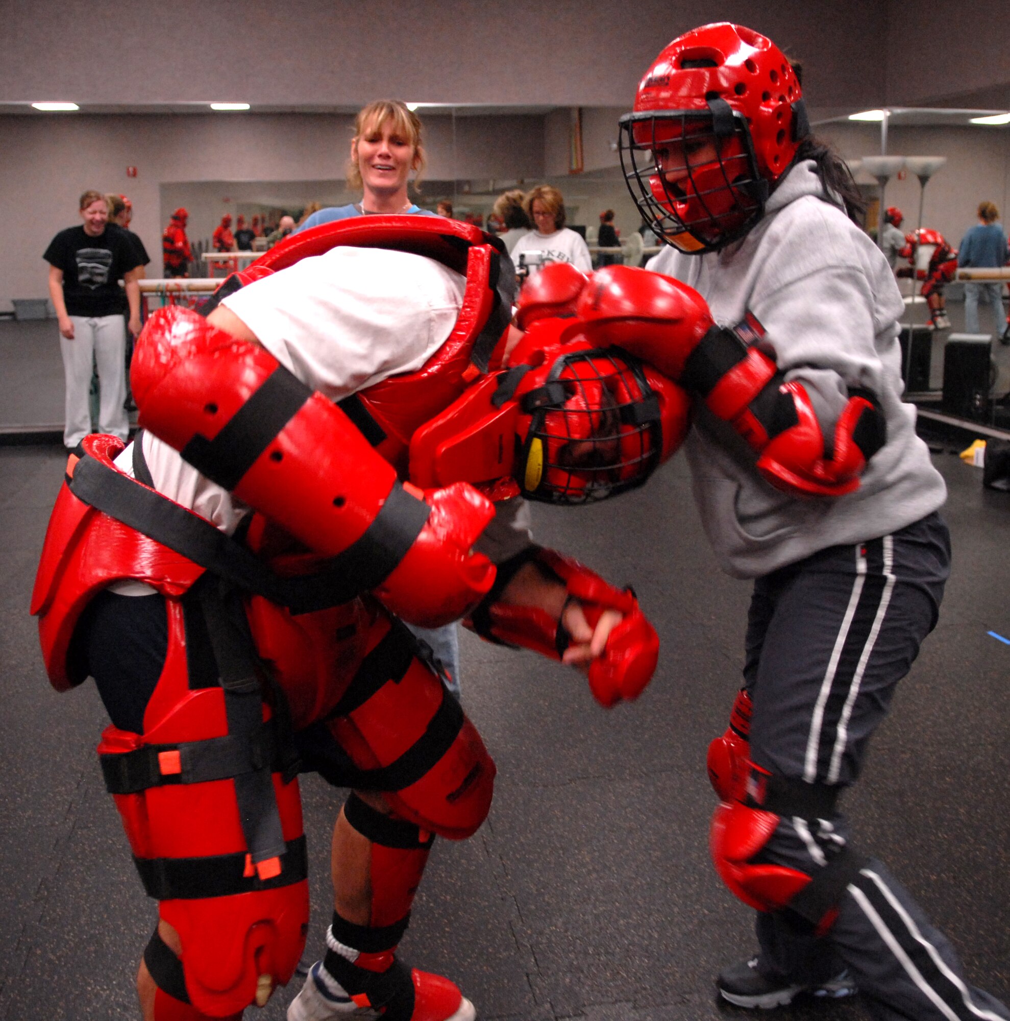 Jessica Forsberg grabs Rich St.John’s head during a training exercise. She learned how to defend herself during the Rape Aggression Defense Class (RAD) at the Health and Wellness Center on November 27, 2007 at Luke Air Force Base, Arizona. Senior Airman Forsberg is a customer service technician from the 56 comptroller squadron.  (photo by Airman First Class David Bulkley) 
