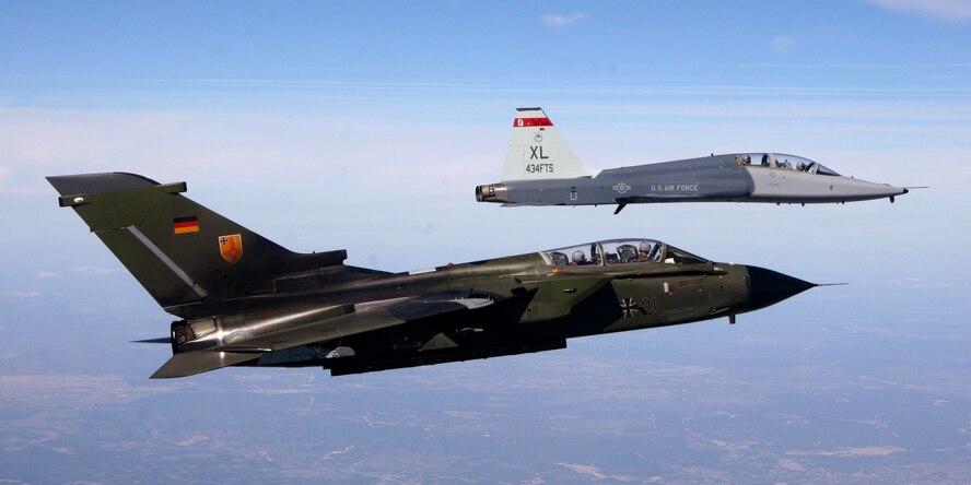 LAUGHLIN AIR FORCE BASE, Texas -- A German air force Tornado fighter jet flies next to a Laughlin T-38 Talon from the 434th Fighter Training Squadron during a recent training mission here.  The German aircrew participated in the first-ever training program with instructor pilots from the 434th FTS that included mock dogfights.  (U.S. Air Force photo by Capt. Patrick Giggy)