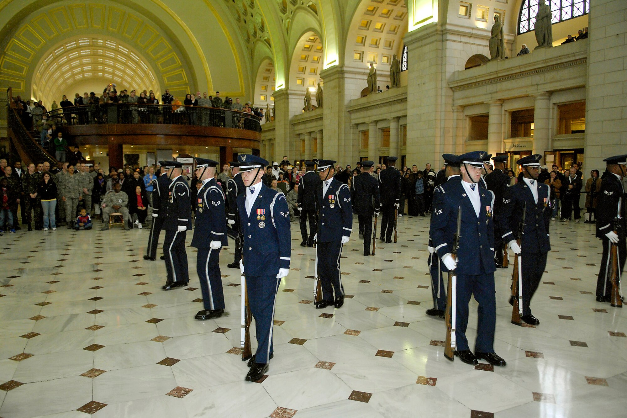 Air Force Honor Guard Drill Team members perform their new "four-corners" drill sequence that represents the global reach of the Air Force Feb. 21 at Union Station in Washington, D.C. The unveiling drill is the first drill of the year and the formal presentation of the 2008 team to Air Force leadership and the general public. The drill team is the traveling component of the Air Force Honor Guard and tours Air Force bases worldwide showcasing the precision of today's Air Force to recruit, retain and inspire Airmen for the Air Force mission. (U.S. Air Force photo/Senior Airman Sean Adams)
