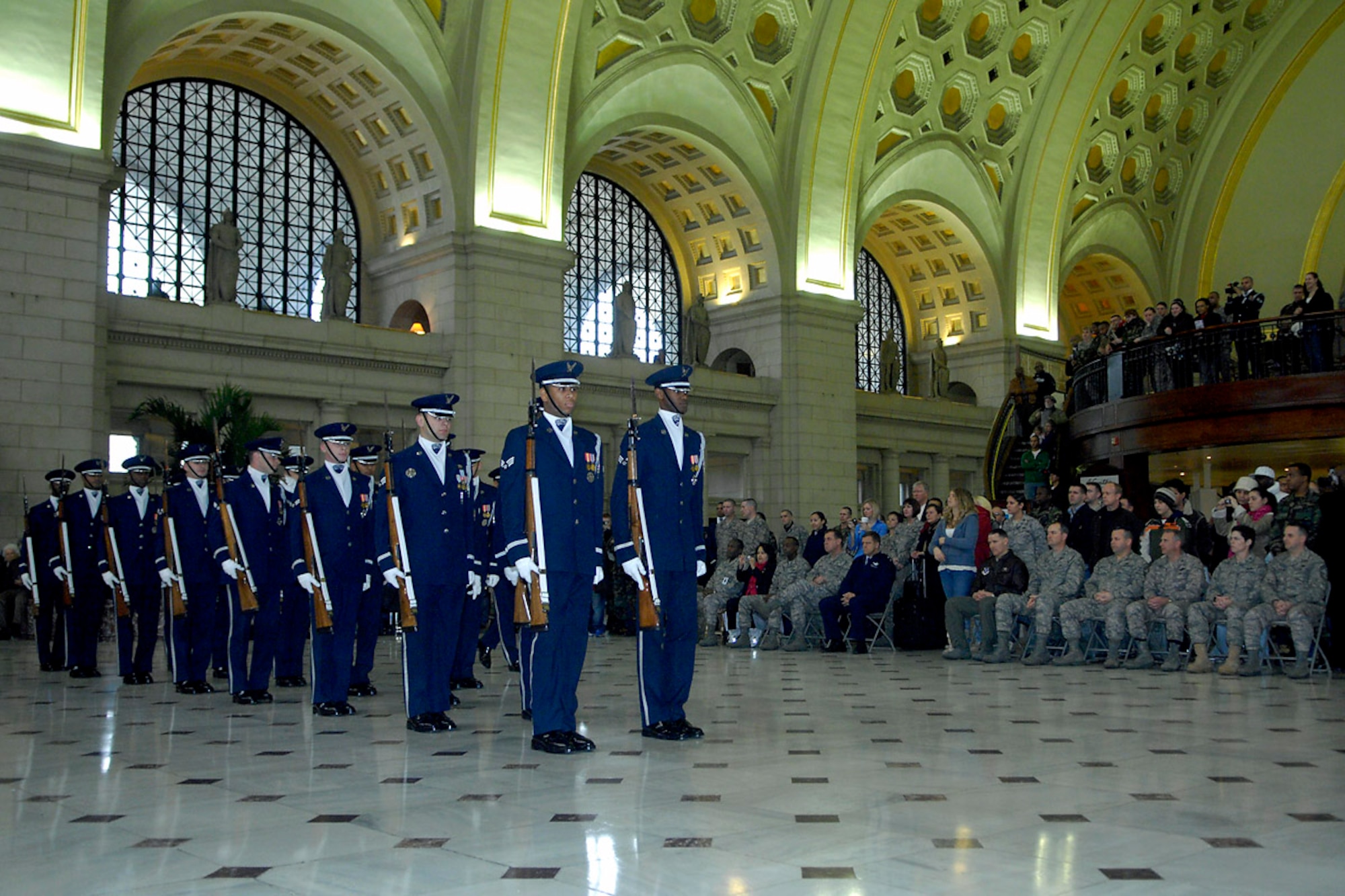 Air Force Honor Guard Drill Team members march in to perform their season unveiling Feb. 21 at Union Station in Washington, D.C. The unveiling drill is the first drill of the year before the team begins touring and the formal presentation of the 2008 team to Air Force leadership and the general public. The drill team is the traveling component of the Air Force Honor Guard and tours Air Force bases worldwide showcasing the precision of today's Air Force to recruit, retain and inspire Airmen for the Air Force mission. (U.S. Air Force photo/Senior Airman Sean Adams)