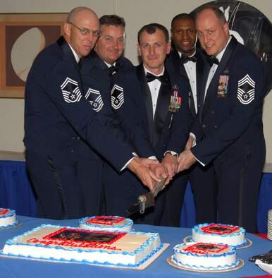 (From left to right) Senior Master Sgts. Richard Nordstrom, Donnie Morris and Leonard Krombel, and Chief Master Sgts. Leonard Howard and Christopher Saylor cut the ceremonial cake at the 2008 Chief Master Recognition Ceremony Feb. 22 at the Tyndall Community Activity Center Annex.  Inductees were selected for the top enlisted rank in the Air Force, an accomplishment achieved by only one percent of the total enlisted force.  (U.S. Air Force photo by Lisa Norman)