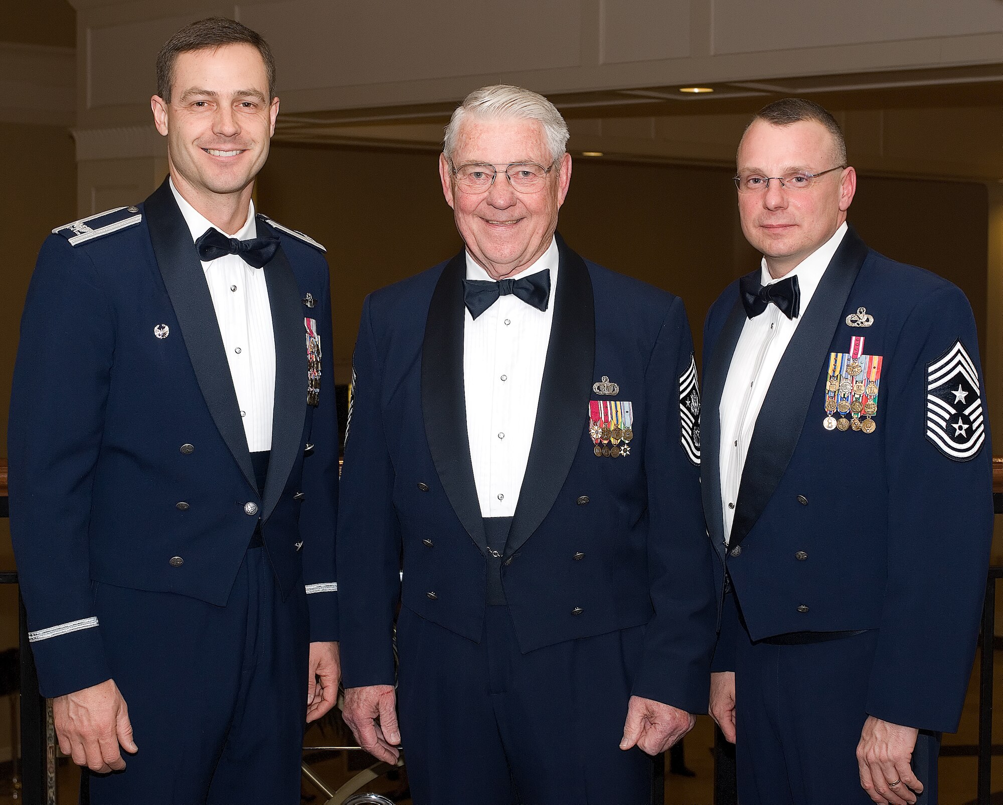 Col. Steve Harrison, 436th Airlift Wing commander, Retired Chief Master Sgt. Robert Gaylor, the fifth Chief Master Sgt. of the Air Force, and Chief Master Sgt. John Wood, 436th AW command chief, at the 436th Airlift Wing Annual Awards Banquet Feb. 20. (U.S. Air Force photo/Roland Balik)