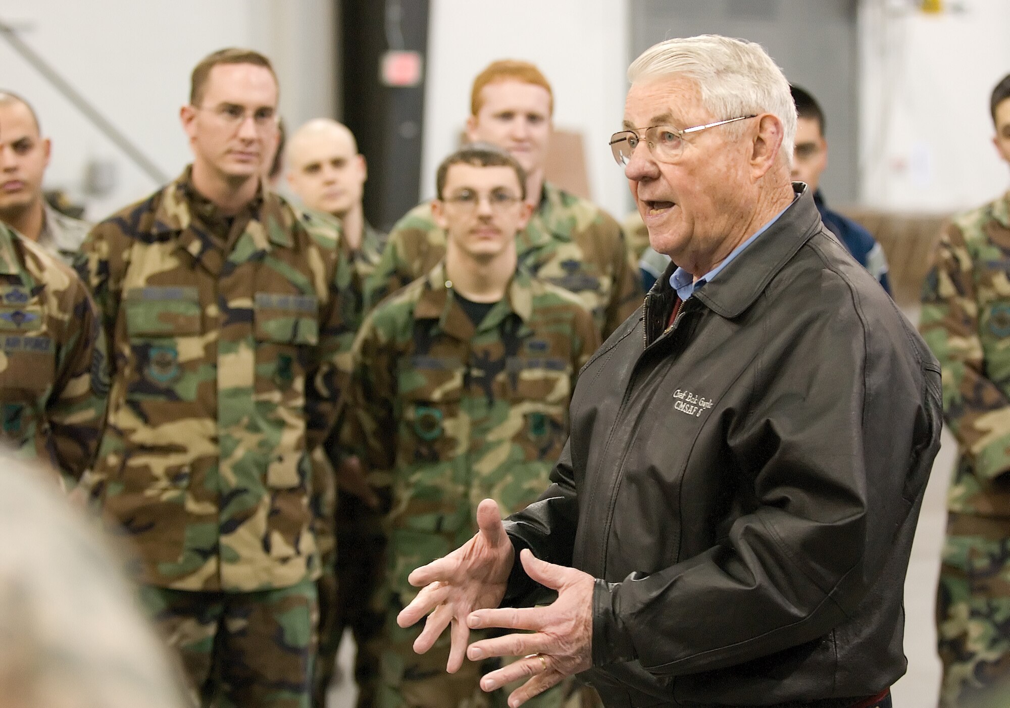 Retired Chief Master Sgt. Robert Gaylor, the fifth Chief Master Sgt. of the Air Force, speaks with 436th Aerial Port Squadron Airmen. The chief visited various locations around Dover Air Force Base prior to speaking at the 436th Airlift Wing Annual Awards Banquet Feb. 20. (U.S. Air Force photo/ Jason Minto)