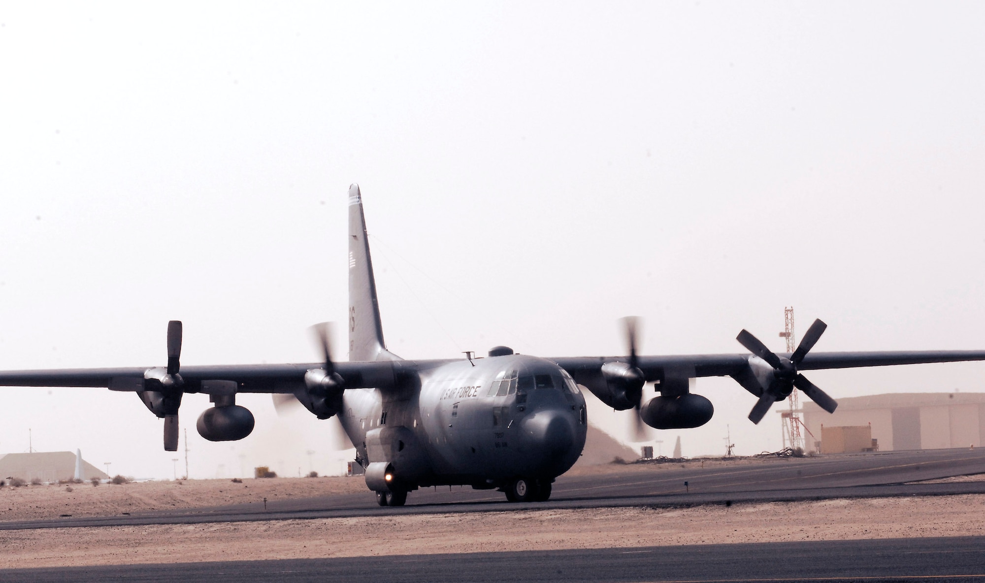 A C-130 Hercules taxis unto the tarmac at an air base in the Southwest Asia. The aircraft is carrying personnel leaving from Operation Iraqi Freedom. (U.S. Air Force photo/ Senior Airman Patrick Dixon) 
