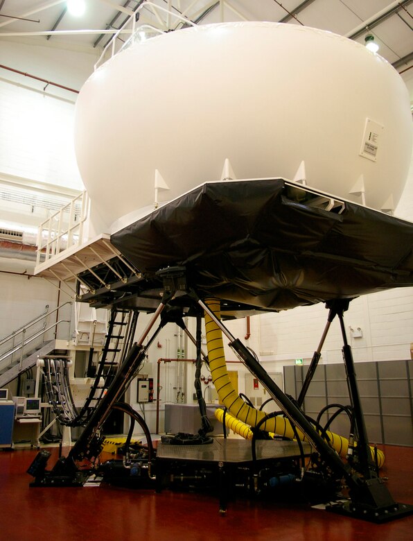 Team Mildenhall's multi-million dollar KC-135 Stratotanker simulator is run by contractors. The five personnel include instructors and technicians, responsible for training aircrews from the 351st Air Refueling Squadron. One hour of training costs around one-tenth of the amount to fly an actual jet. (U.S. Air Force photo by Karen Abeyasekere)