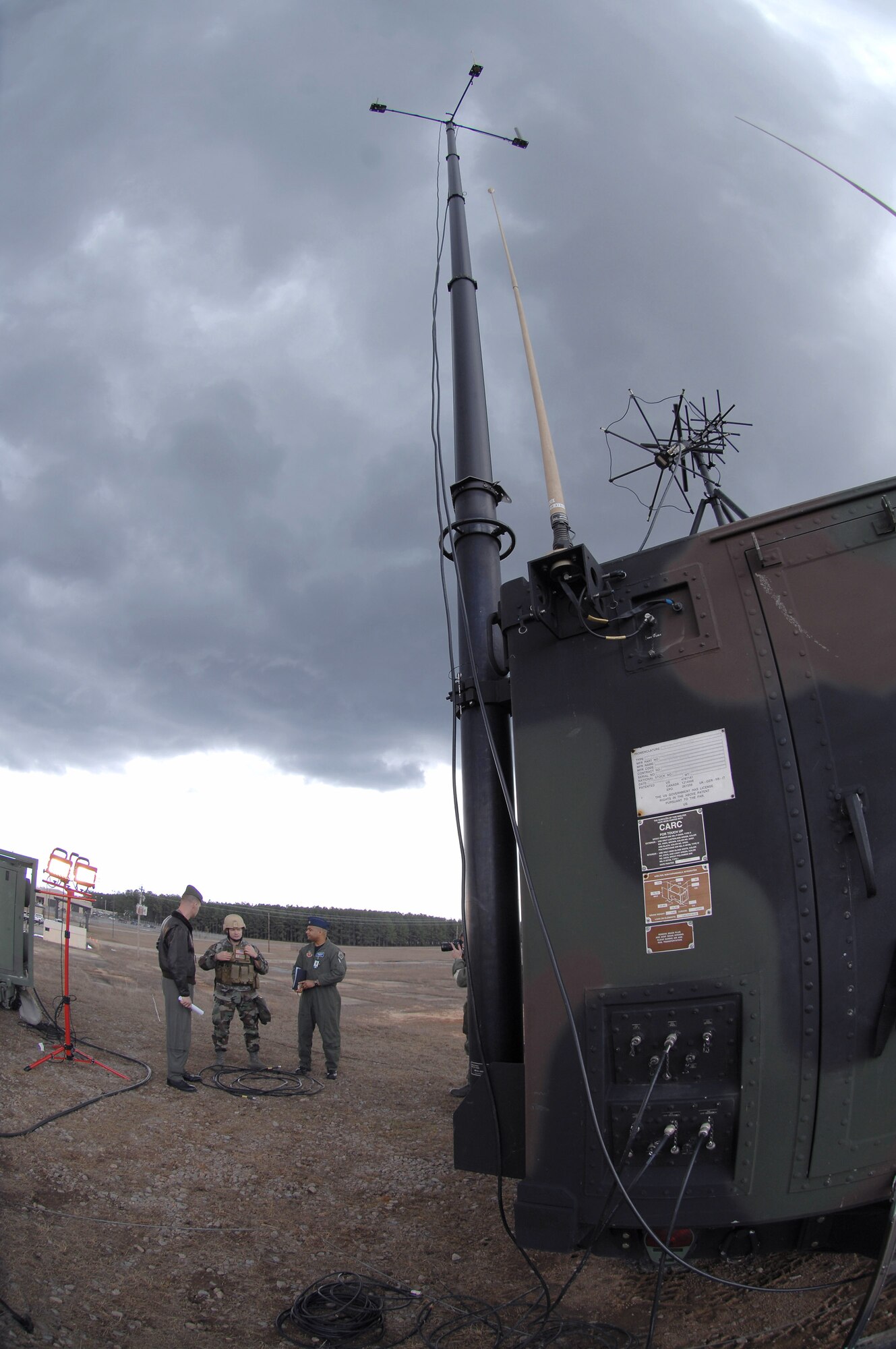 Staff Sgt. Justin Cremer (middle) briefs Marine Corps Lt. Col. Robert Cooper (left) and Maj. Darren Gray on the Air Support Operations Center Gateway Feb. 13 at Shaw Air Force Base, S.C. The Gateway, a vehicle mounted communications system, is going through its final tests during an operational readiness exercise before it will be used in theater operations. Sergeant Cremer is the 682nd Air Support Operations Squadron operations training manager, Colonel Cooper is the 609th Combat Operations Squadron U.S. Central Forces weapons officer and Major Gray is the 609th Combat Plans Squadron special assistant to U.S. Central Forces commander. (U.S. Air Force photo/Staff Sgt. Nathan Bevier) 