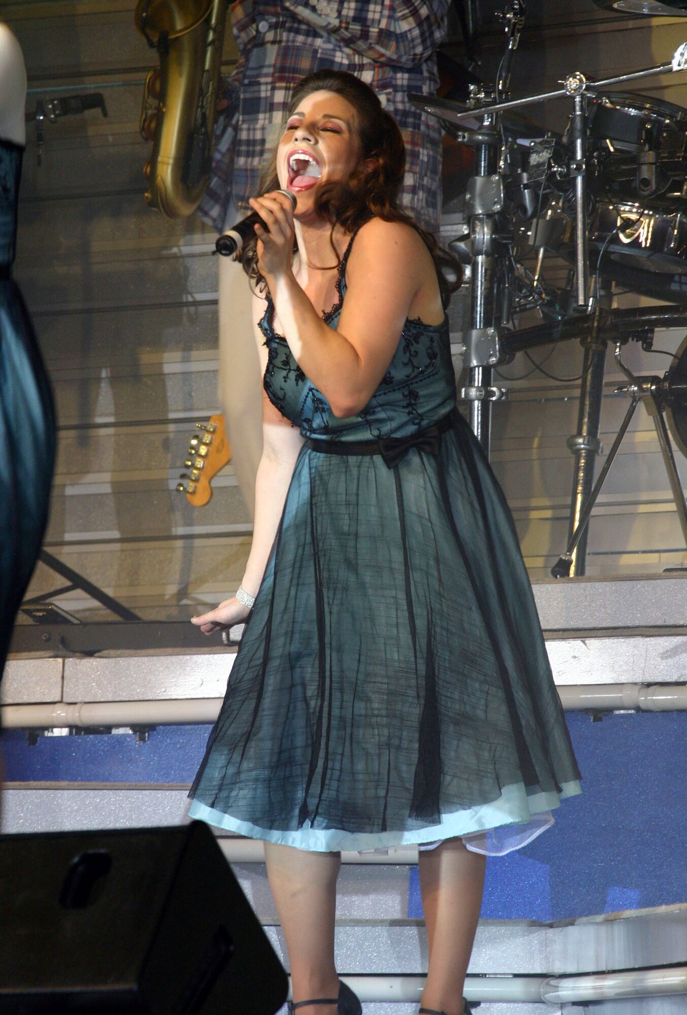 LAUGHLIN AIR FORCE BASE, Texas—1st Lt. Kimberly Robinson, Tops in Blue vocalist and Del Rio native, sings to Laughlin members Feb. 23 in the weather shelter. The theme for this year’s tour was “The Fly-By,” a musical tribute to the 60 years of proud Air Force history. (U.S. Air Force photo by Airman 1st Class Sara Csurilla)
