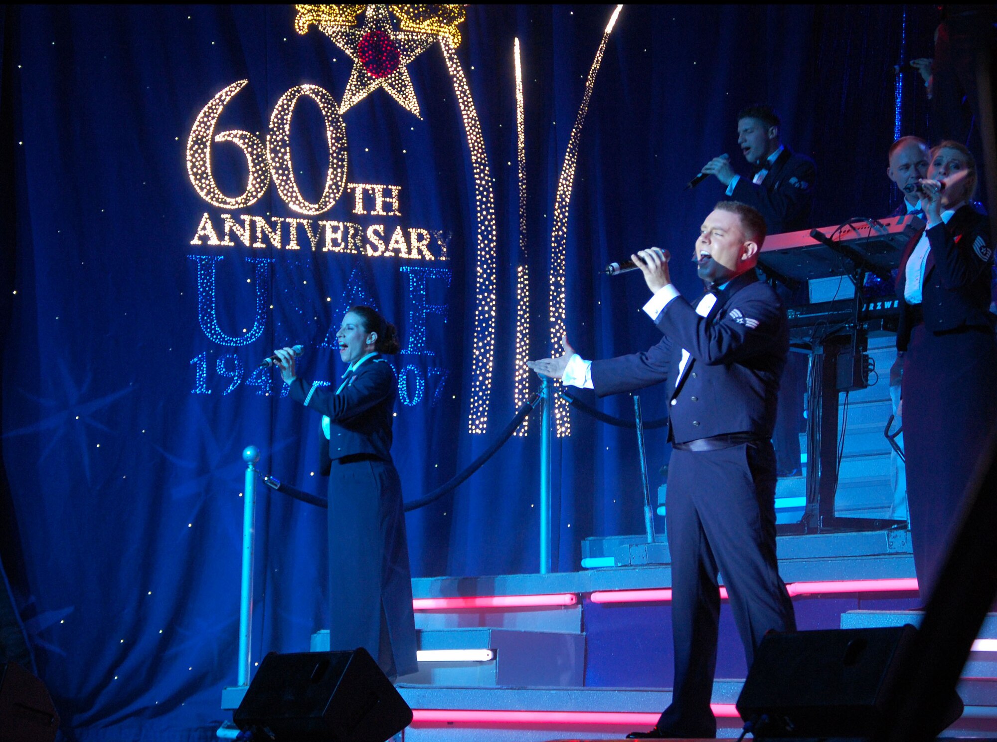 LAUGHLIN AIR FORCE BASE, Texas—Members of Tops in Blue sing for Laughlin members Feb. 23 in the weather shelter. The theme for this year’s tour was “The Fly-By,” a musical tribute to the 60 years of proud Air Force history. (U.S. Air Force photo by Airman 1st Class Sara Csurilla)