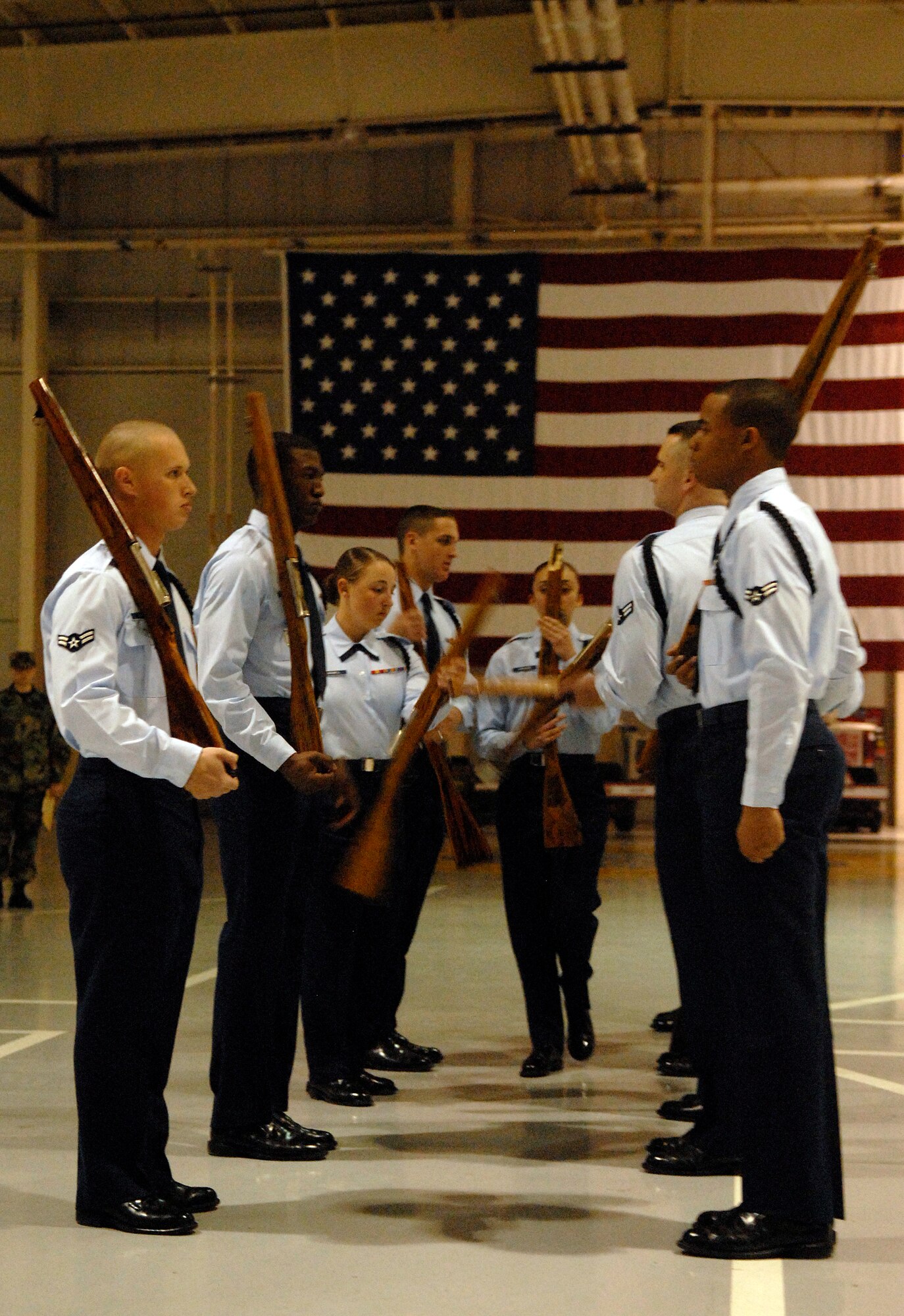 Students from the 312th Training Squadron use rifles during their Exhibition routine. (U.S. Air Force photo by Senior Airman Kamaile Chan)