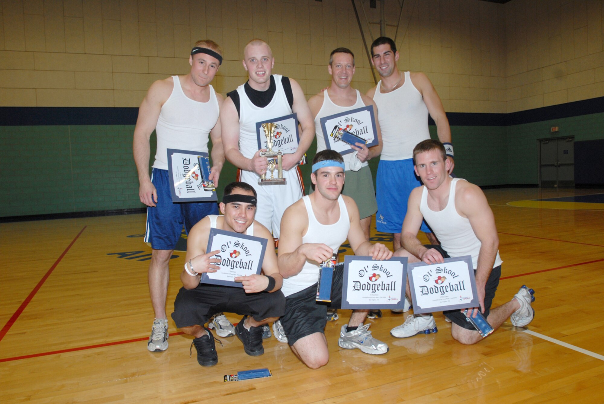 Members of the 315th Training Squadron Big’ns pose for a team photo after winning the Ol’ Skool Dodgeball Tournament Championship match Feb. 7 at the Mathis Fitness Center gymnassium. The members of theseven-player team were presented with individual certificates and headbands to go along with their trophy. (U.S. Air Force photo by Tech. Sgt. Gina O’Bryan)
