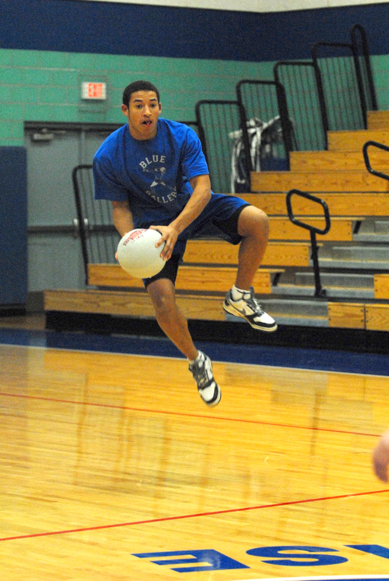 Laurence Nance from the 17th Mission Support Squadron Blue Ballers becomes airborn during the championship against the 315th Training Squadron Big’ns. (U.S. Air Force photo by Tech. Sgt. Gina O’Bryan)