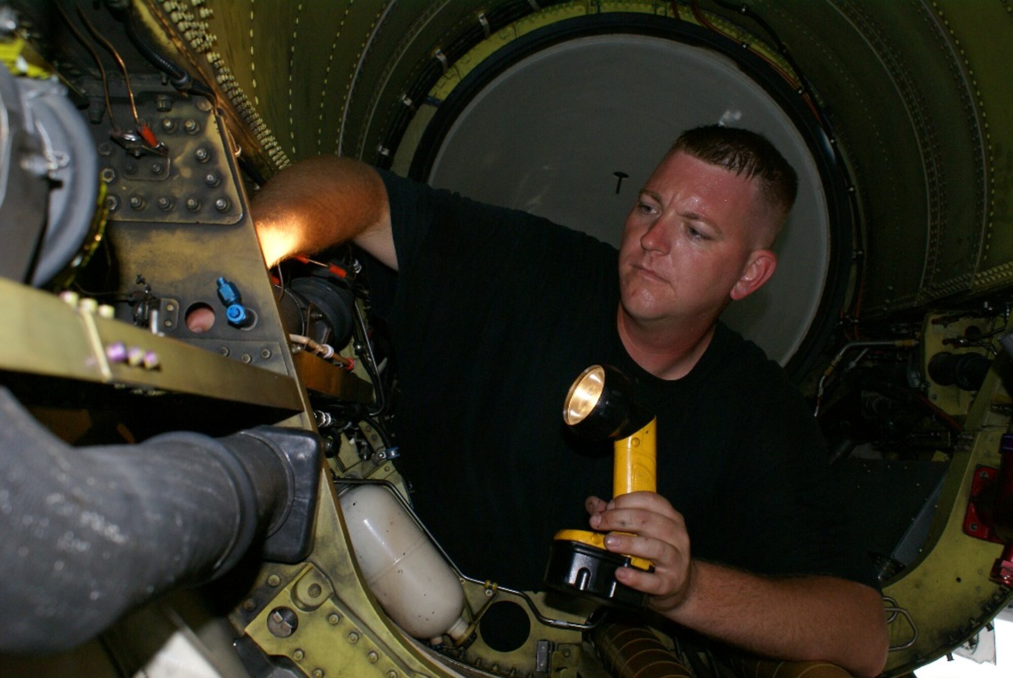 Staff Sgt. Theodore Yoder, 482nd Aircraft Maintenance Squadron crew chief, thoroughly inspects the engine bay of an F-16 Fighting Falcon on Feb. 25. The inspection is performed any time an engine is replaced in the fighter jet. (U.S. Air Force photo/Senior Airman Erik Hofmeyer) 