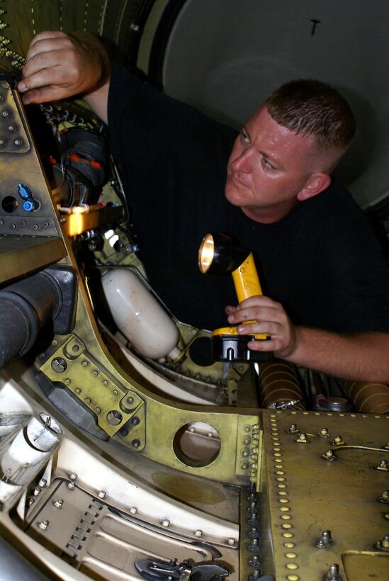 Staff Sgt. Theodore Yoder, 482nd Aircraft Maintenance Squadron crew chief, uses a flashlight to thoroughly inspect the engine bay of an F-16 Fighting Falcon on Feb. 25. The inspection is performed any time an engine is replaced in the fighter jet. (U.S. Air Force photo/Senior Airman Erik Hofmeyer) 