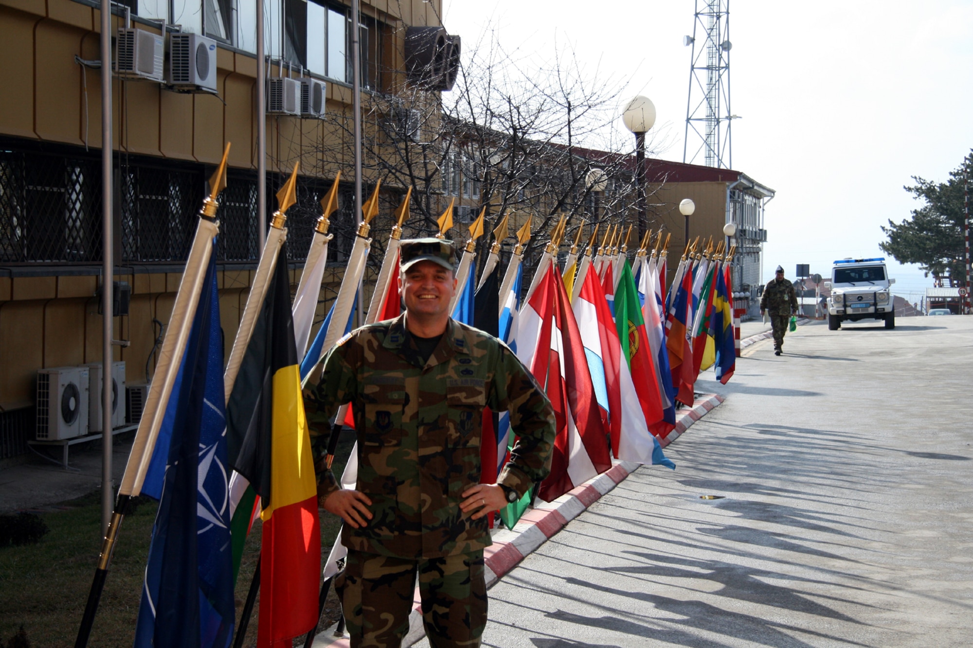 PRISTINA, Kosovo -- Capt. Richard Barnhart, from Spangdahlem’s 52nd Contracting Squadron, stands in front of the Kosovo Forces headquarters building at Film City, in Pristina, Kosovo. The captain, who is currently deployed to Kosovo, describes how the atmosphere feels in the capital city following the country’s announcement of independence. (Courtesy photo)