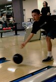 Caleb Millander bowls during the Worldwide Youth Bowling Tournament at Starlifter Lanes Saturday. Caleb is the 10-year-old son of Col. John "Red" Millander. (U.S. Air Force photo/Senior Airman Nicholas Pilch)