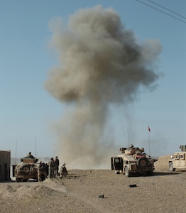 Soldiers with 1st Battalion, 508th Infantry Regiment and Special Operations Forces search for enemy fighters after Air Force munitions strike a target in the Sangin District of Afghanistan April 10, 2007. (U.S. Army photo/ Spc. Daniel Love)