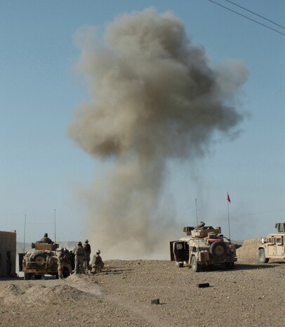 Soldiers with 1st Battalion, 508th Infantry Regiment and Special Operations Forces search for enemy fighters after Air Force munitions strike a target in the Sangin District of Afghanistan April 10, 2007. (U.S. Army photo/ Spc. Daniel Love)