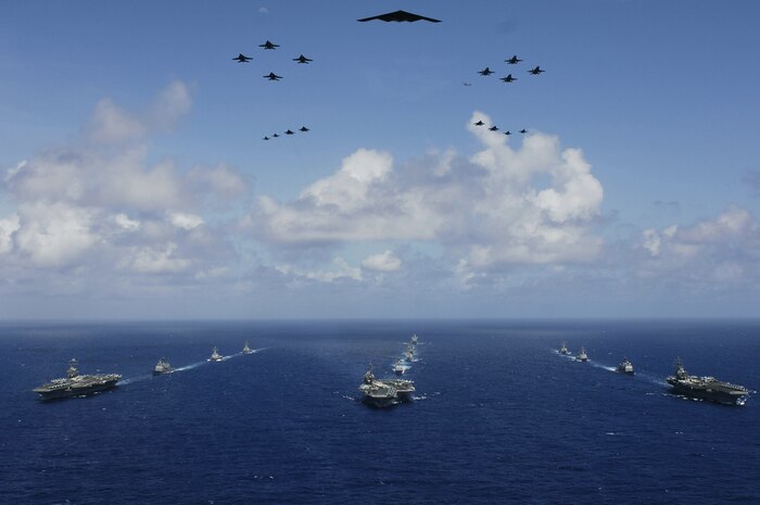 Air Force and naval aircraft fly over the USS Abraham Lincoln (CVN 72), USS Kitty Hawk (CV 63) and USS Ronald Reagan (CVN 76) carrier strike groups in the Philippine Sea June 18, 2006, during exercise Valiant Shield 2006. (DOD photo/Photographer's Mate 3rd Class Jarod Hodge)