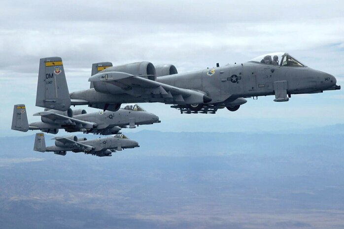 Three A-10 Thunderbolt IIs fly in formation. A-10s provided close-air-support near Balad, Iraq. (U.S. Air Force photo/Senior Airman Christina Ponte) 
