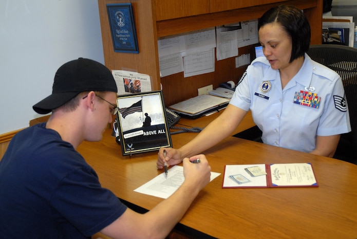 Tech. Sgt. Lisa Russey reviews the Military Entrance Processing Station briefing checklist with David Krahn in the North Charleston Air Force recruiting office Tuesday. Sergeant Russey is an Air Force recruiter with the 336th Recruiting Squadron who is helping Mr. Krahn go "Above All" by joining the Air Force. (U.S. Air Force photo/Senior Airman Sam Hymas)