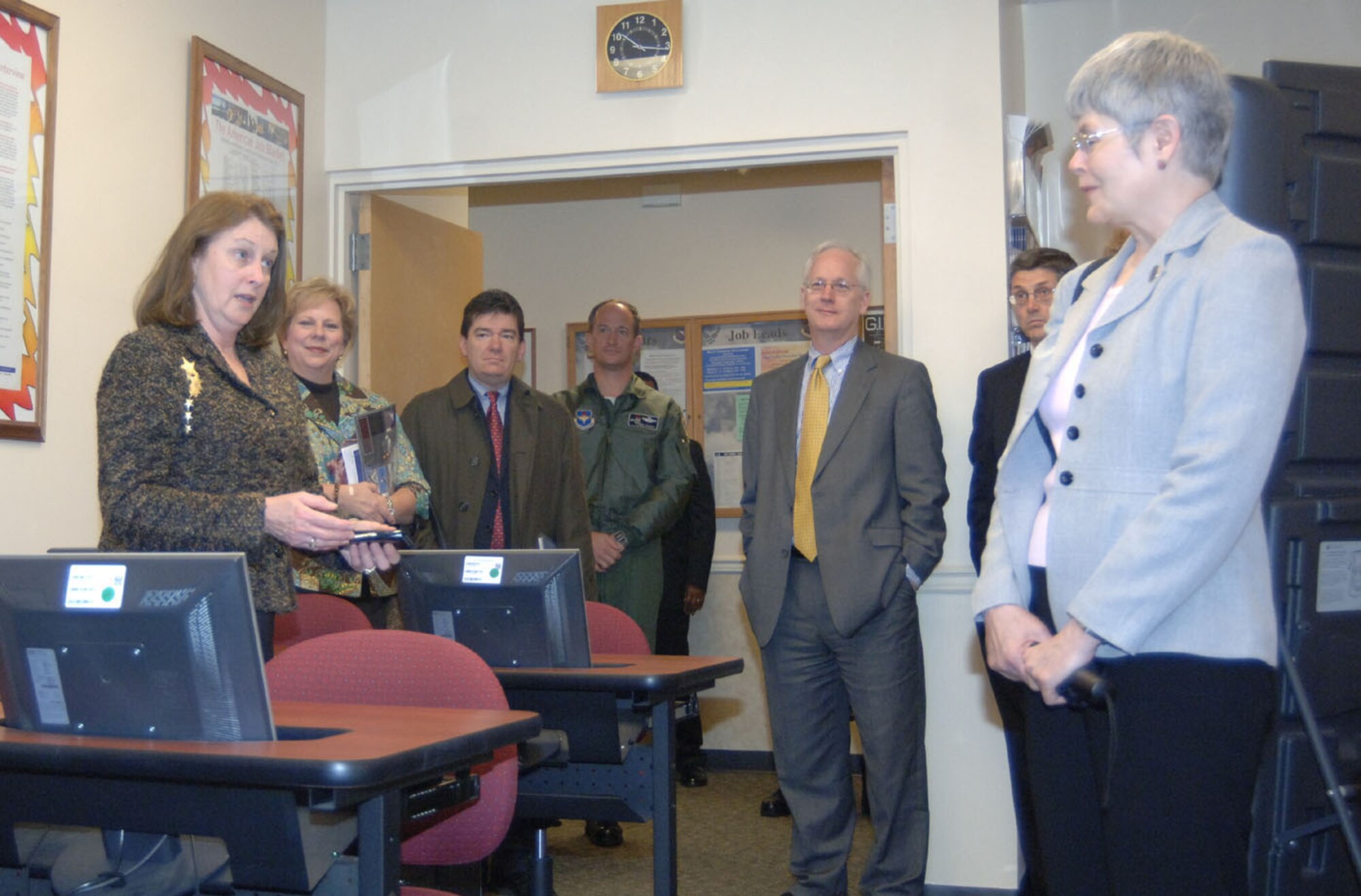Patsy Wood, 14th Force Support Squadron, gives a presentation to Mississippi University for Women's President, Dr. Claudia Limbert, and her cabinet members Friday. The MUW representatives toured CAFB to build a better relationship with the base and to see where their services could be beneficial to BLAZE Team members. (U.S. Air Force photo by Airman 1st Class Danielle Hill)