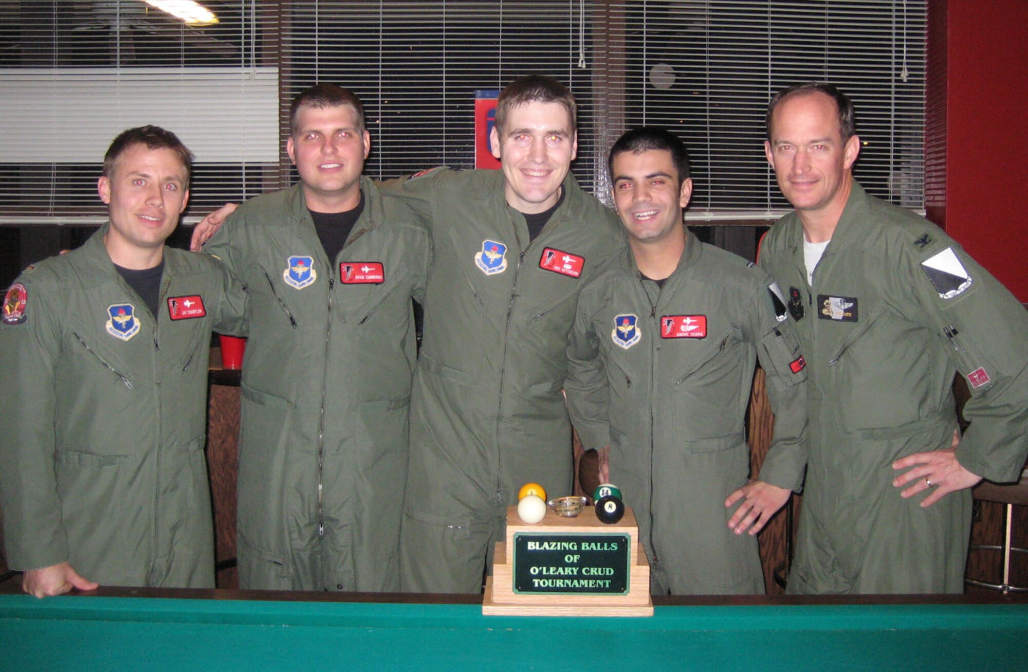 Members of the Specialized Undergraduate Pilot Training Class 08-09 took home the Blazing Balls of O'Leary crud tournament trophy Friday night following the Specialized Undergraduate Pilot Training class 08-06 assignment night. The members of the winning team are: 2nd Lt. Jay Doerfler, 2nd Lt. Ryan Cummings, 2nd Capt. Eric Hutcheson and 2nd Lt. Andre Serra. They are seen here with Col. Dave Gerber, 14th Flying Training Wing commander. (U.S. Air Force photo by 2nd Lt. Carlos Hernandez)