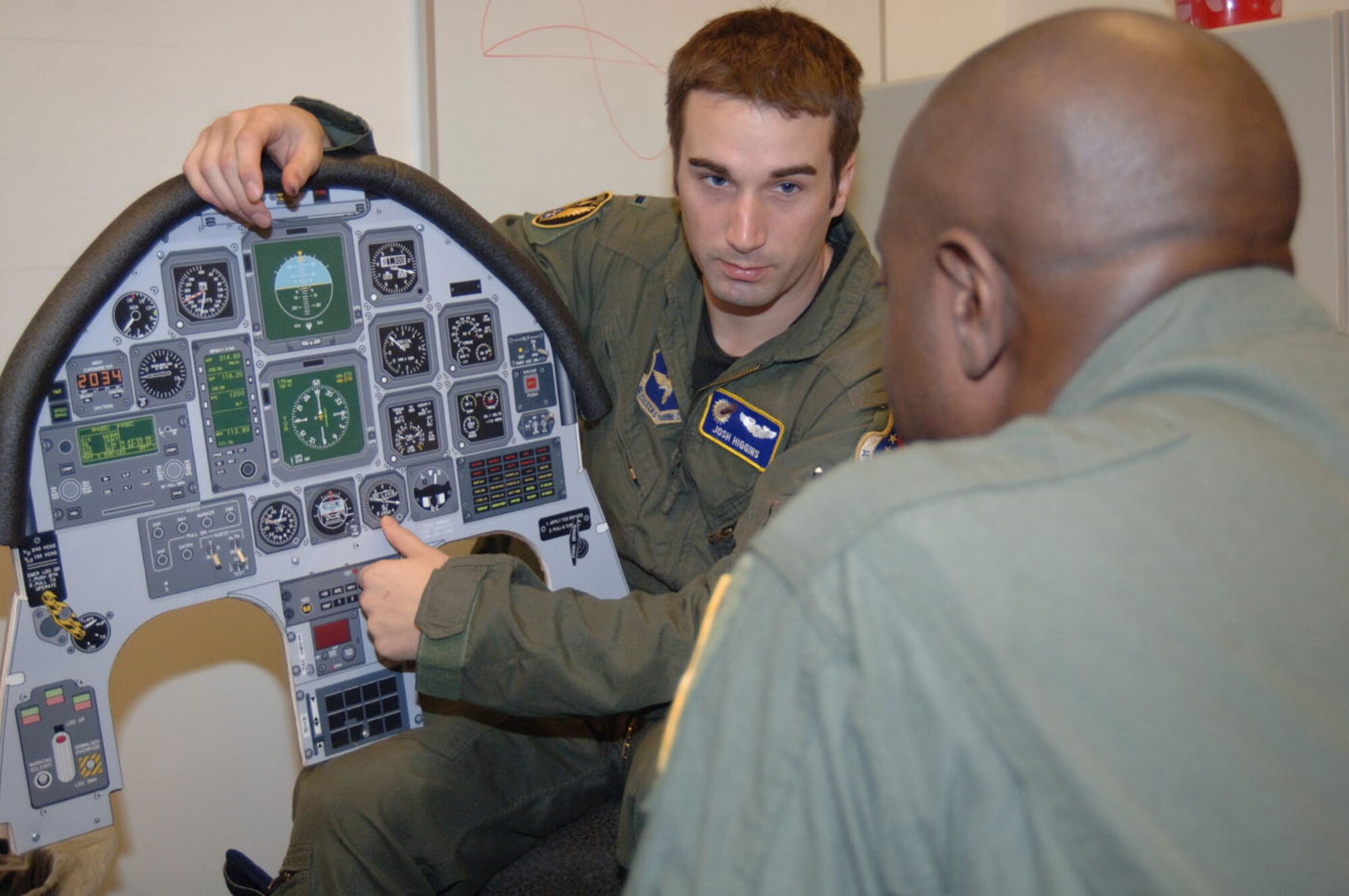 Second Lt. Joshua Higgins, 41st Flying Training Squadron, briefs Tech. Sgt. Anthony Fleming, 332nd Recruiting Squadron, before their T-6 flight Tuesday. Sergeant Fleming was named the top recruiter for 2006 and 2007 in eastern Tennessee. (U.S. Air Force photo by Airman 1st Class Danielle Hill)