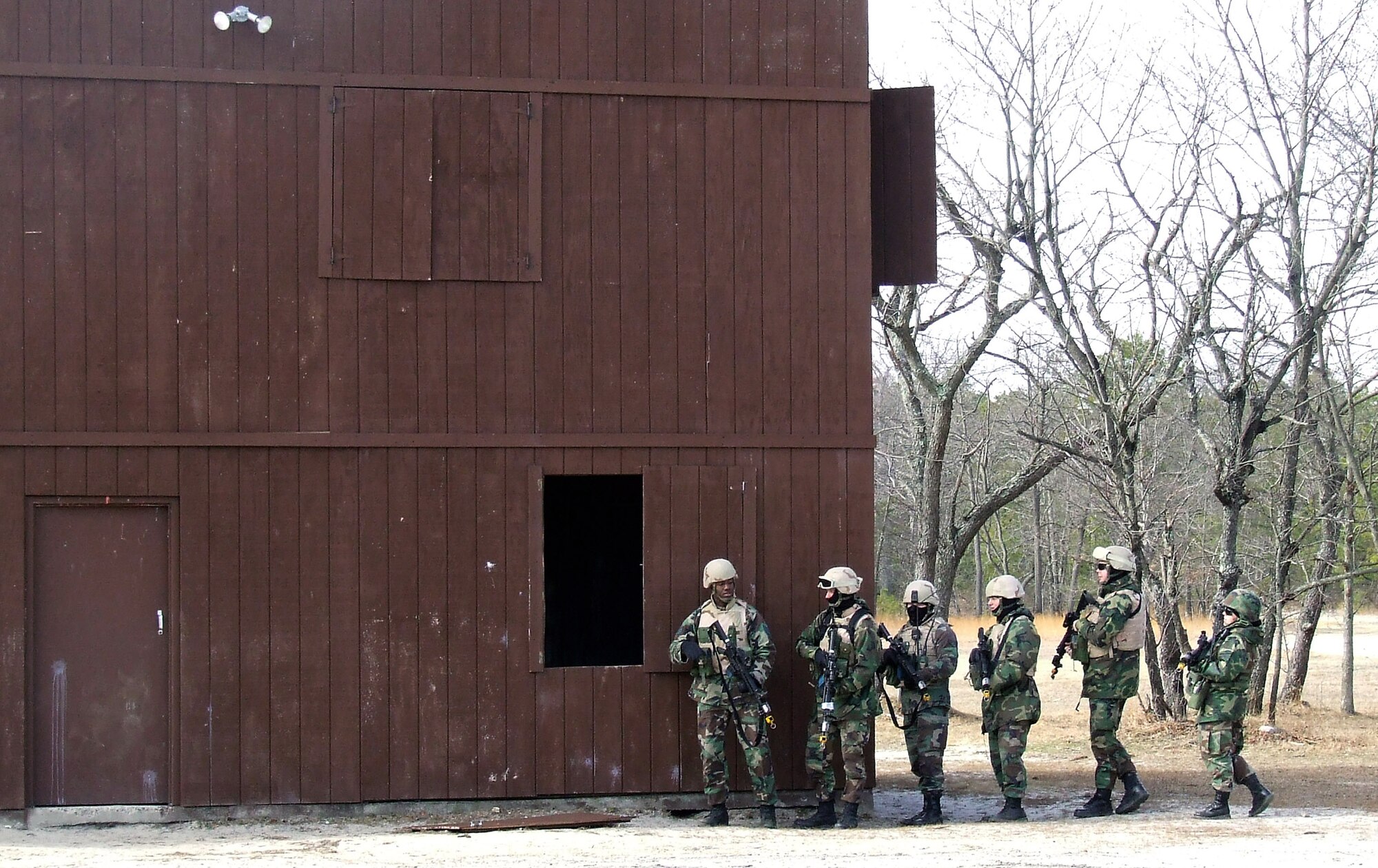 Students in the Air Force Phoenix Warrior Training Course 08-3 practice a military operations in urban terrain scenario scenario during training Feb. 20 on a range at Fort Dix, N.J. The course is taught by members of the Air Force Expeditionary Center's Expeditionary Operations School and 421st Combat Training Squadron and the course prepares security forces Airmen for upcoming deployments. (U.S. Air Force photo/Tech. Sgt. Scott T. Sturkol)
