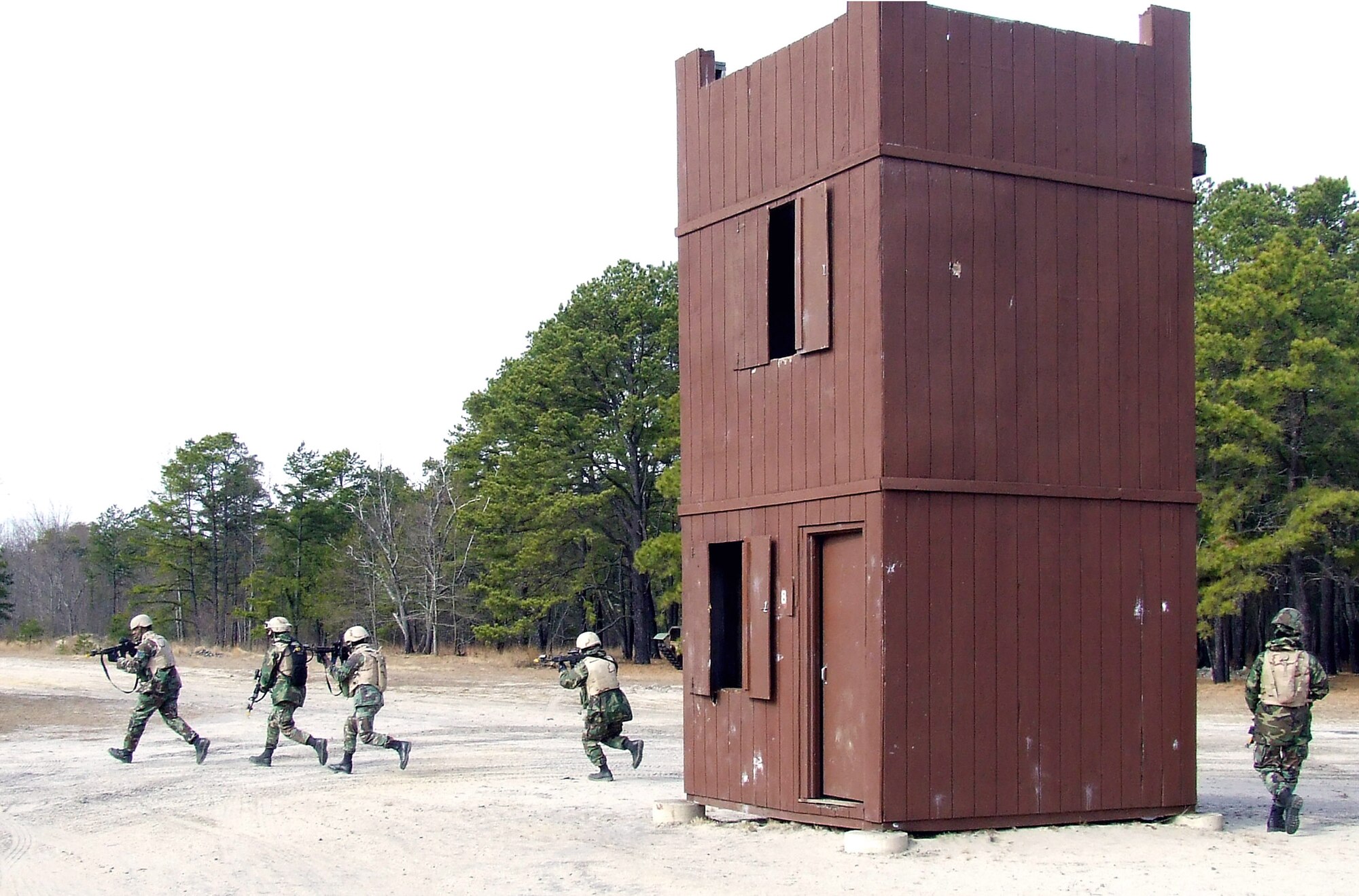 Students in the Air Force Phoenix Warrior Training Course 08-3 practice a military operations in urban terrain scenario scenario during training Feb. 20 on a range at Fort Dix, N.J. The course is taught by members of the Air Force Expeditionary Center's Expeditionary Operations School and 421st Combat Training Squadron and the course prepares security forces Airmen for upcoming deployments. (U.S. Air Force photo/Tech. Sgt. Scott T. Sturkol)
