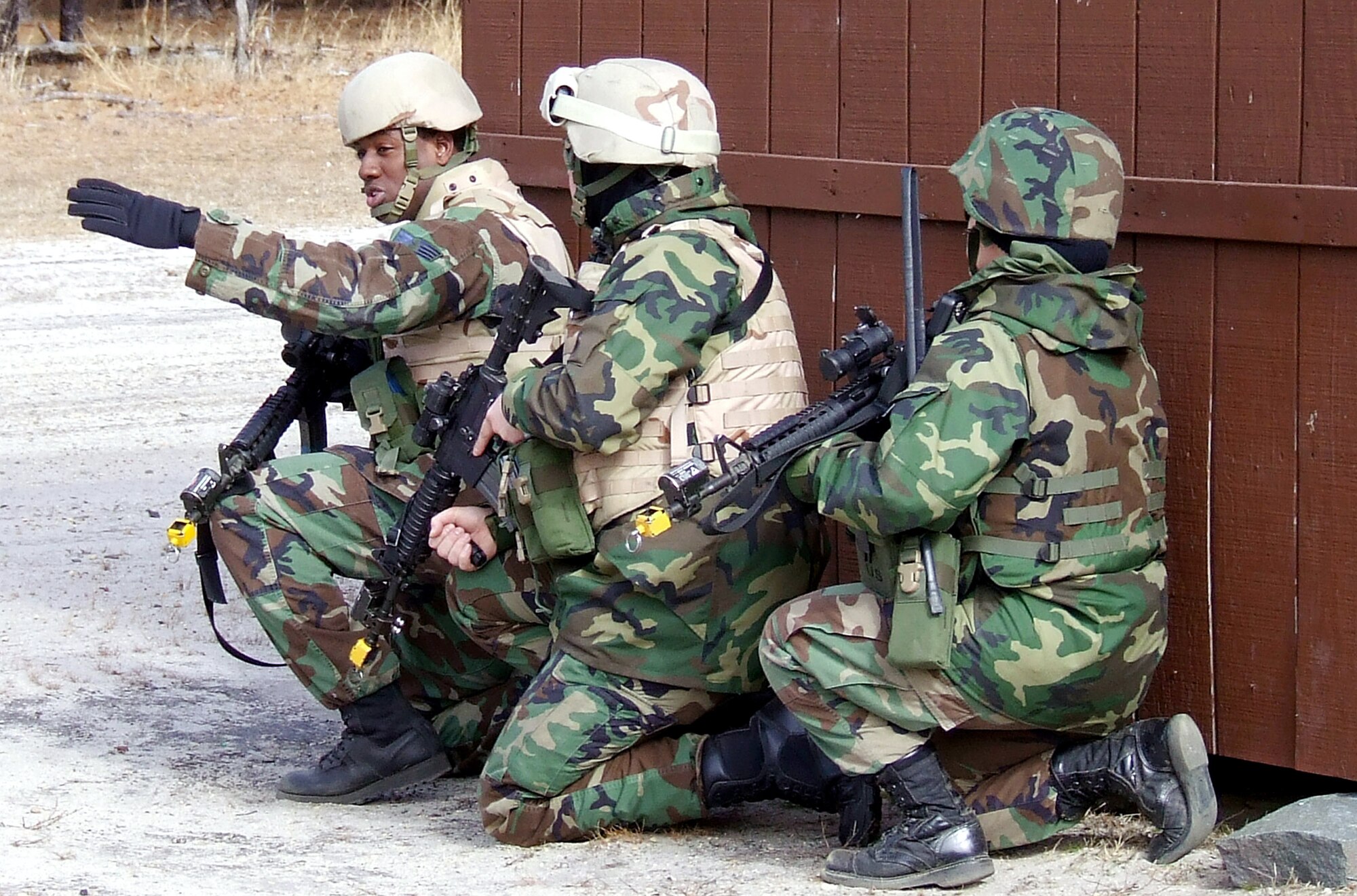 Staff Sgt. Robert Graves leads a group of students in a military operations in urban terrain scenario during training Feb. 20 on a range at Fort Dix, N.J. The course is taught by members of the Air Force Expeditionary Center's Expeditionary Operations School and 421st Combat Training Squadron and the course prepares security forces Airmen for upcoming deployments. Sergeant Graves is assigned to the 569th U.S. Forces Police Squadron from Vogelweh Air Base, Germany, and is a student in the Air Force Phoenix Warrior Training Course 08-3. (U.S. Air Force photo/Tech. Sgt. Scott T. Sturkol) 
