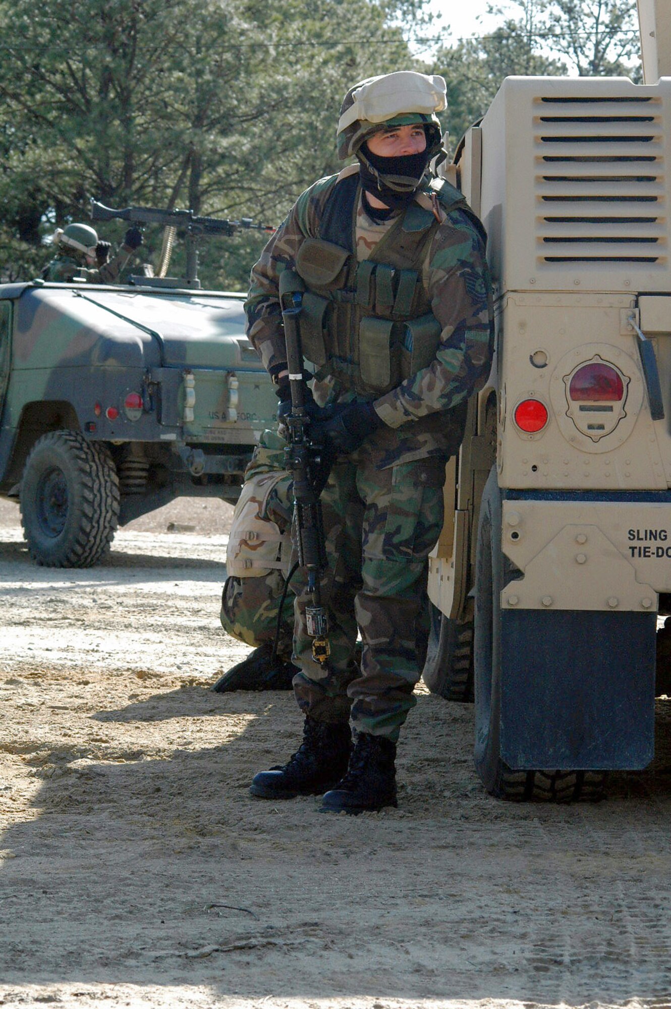 Tech. Sgt. David Barry takes up a defensive position during a scenario for training for the course Feb. 20 on a range at Fort Dix, N.J. The course is taught by members of the Air Force Expeditionary Center's Expeditionary Operations School and 421st Combat Training Squadron and prepares security forces Airmen for upcoming deployments. Sergeant Barry is a 721st Security Forces Squadron member from Cheyenne Mountain Air Force Station, Colo., and a student in the Air Force Phoenix Warrior Training Course 08-3. (U.S. Air Force photo/Tech. Sgt. Scott T. Sturkol)
