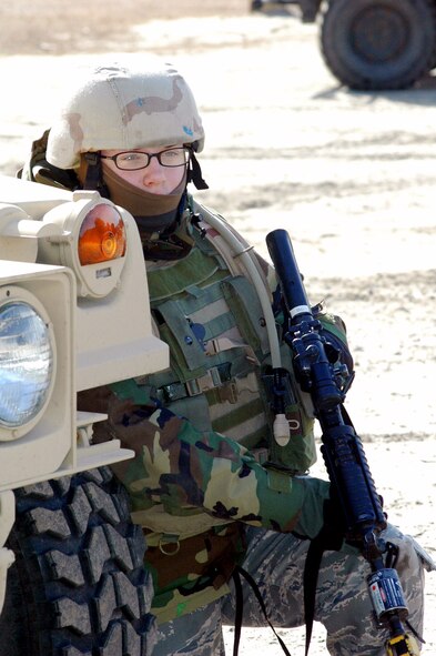 Airman 1st Class Jamie Elrod takes up a defensive position during a scenario for training for the course Feb. 20 on a range at Fort Dix, N.J. The course is taught by members of the Air Force Expeditionary Center's Expeditionary Operations School and 421st Combat Training Squadron and prepares security forces Airmen for upcoming deployments. Airman Elrod is a 49th Security Forces Squadron member from Hollomon Air Force Base, N.M., and a student in the Air Force Phoenix Warrior Training Course 08-3. (U.S. Air Force photo/Tech. Sgt. Scott T. Sturkol)