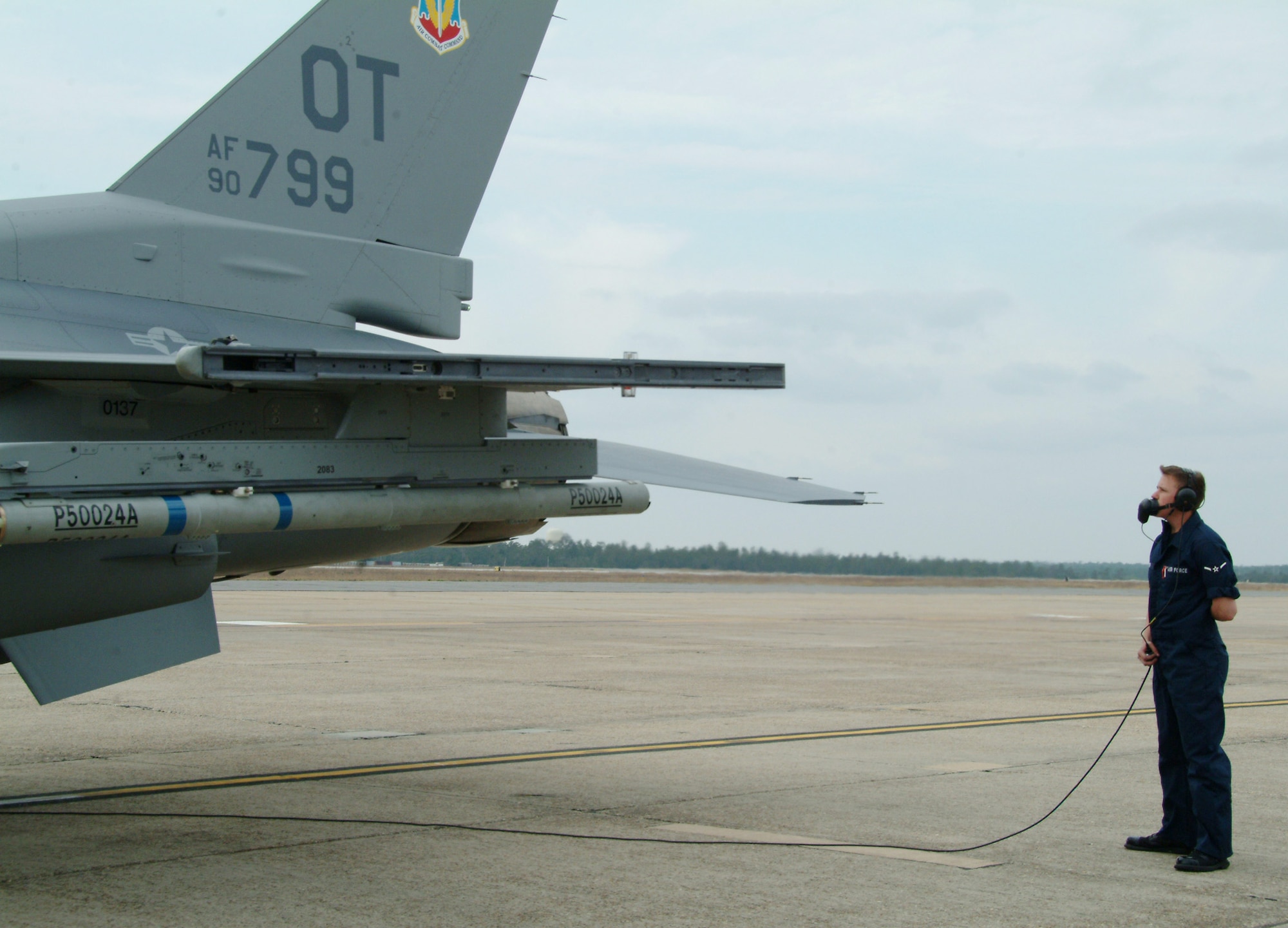 Airman Ryan Galler, 46th Aircraft Maintenance Squadron, talks to pilot Lt. Col. Eugene Booth, 86th Fighter Weapons Squadron, as they perform the final checks before the F-16 Fighting Falcon taxis to the runway Feb. 26 at Eglin Air Force Base, Fla.  U.S. Air Force photo by Staff Sgt. Samuel King Jr.