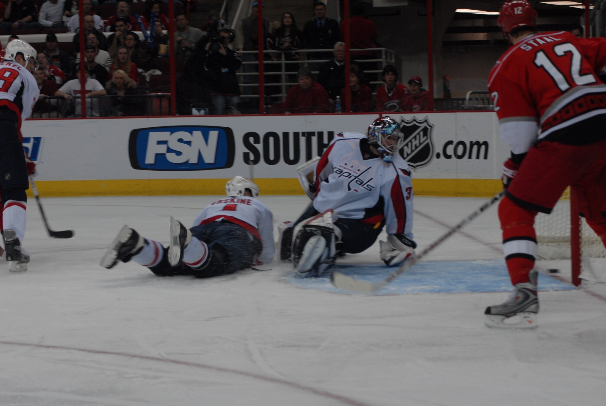 Washington Capitals goaltender Olaf Kolzig watches the puck slide over the goal line for a Carolina Hurricanes goal during Military Appreciation Night Feb. 23 in Raleigh, N.C. Pope received 250 tickets for the NHL game at the RBC Center. (U.S. Air Force Photo by 2nd Lt. Chris Hoyler)