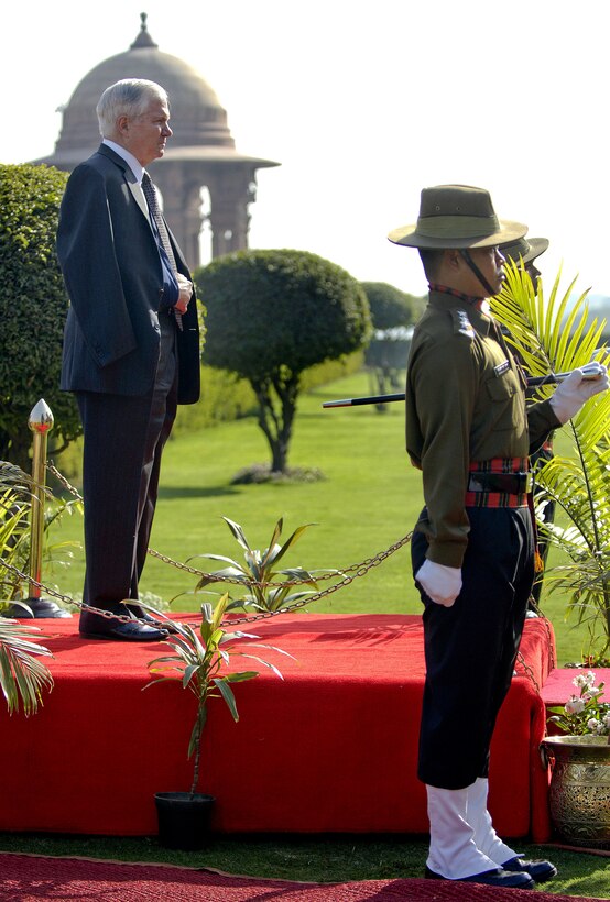 Defense Secretary Robert M. Gates watches on after performing a pass in review on Indian service members in New Delhi, India, Feb. 27, 2008.  