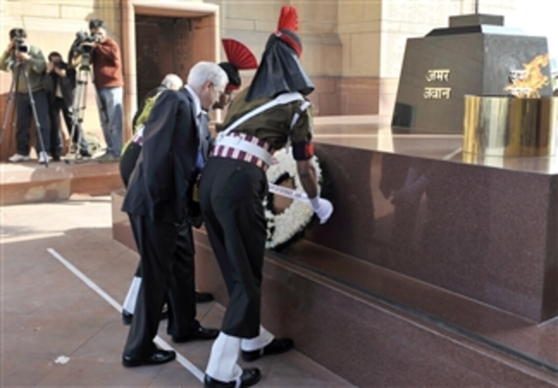 Defense Secretary Robert M. Gates, assisted by members of the Indian Honor Guard, places a wreath at the India Gate Memorial in New Delhi, India, Feb. 27, 2008.  The memorial commemorates the Indian soldiers who died in World War I and the Afghan Wars. 