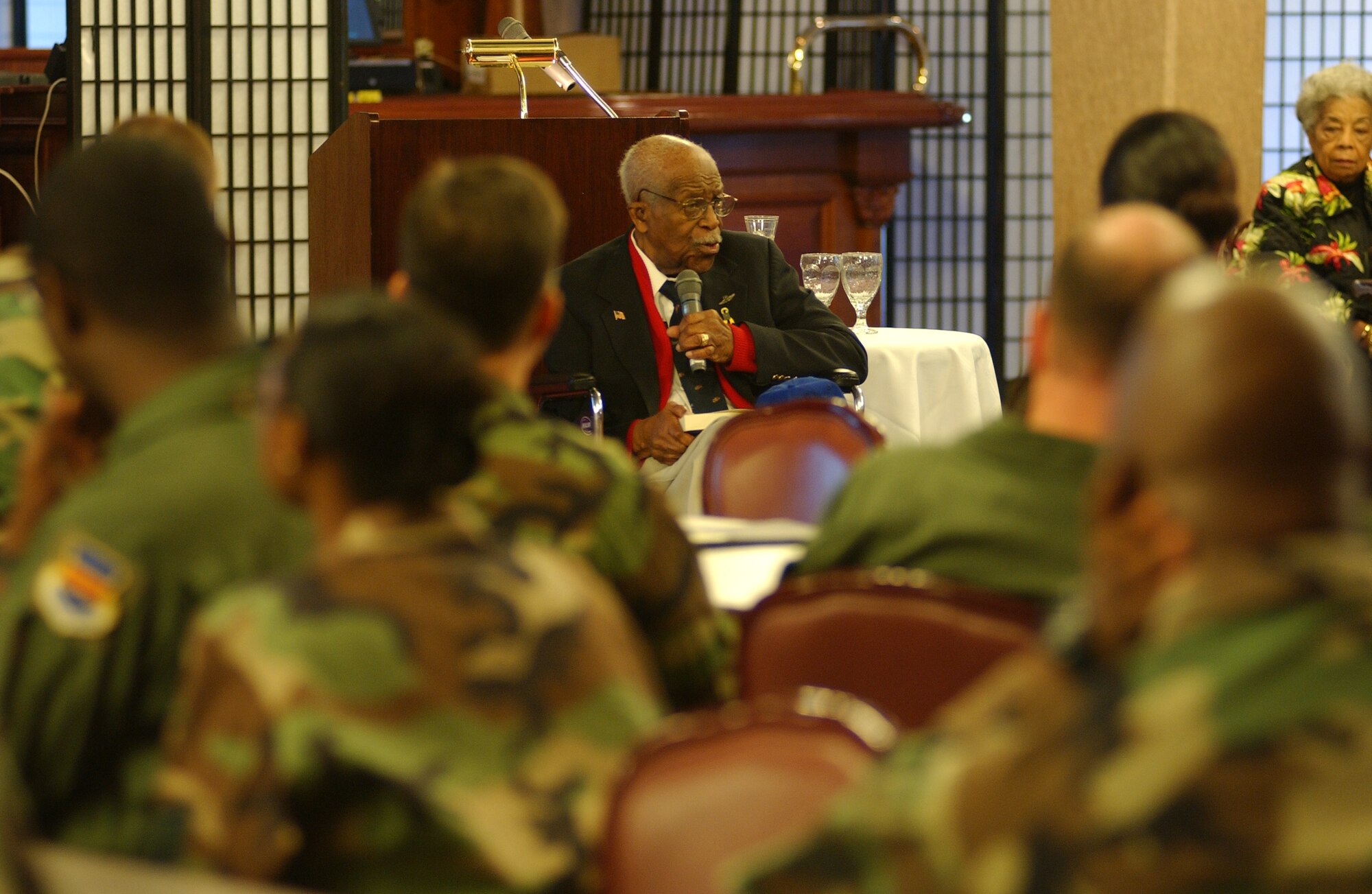 Retired Lt. Col. Charles W. Dryden speaks at the Rocker NCO Club Feb. 25. to inform people the important role Tuskegee Airmen had during World War II. 
(U.S. Air Force photo/Tech. Sgt. Rey Ramon)

